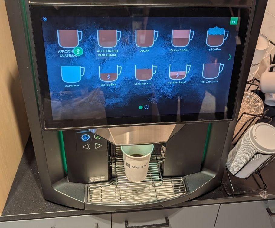 This coffee machine is huge. I think it runs Windows 11 Pro. I'm trying the energy shot which is the one with the lighting bolt.