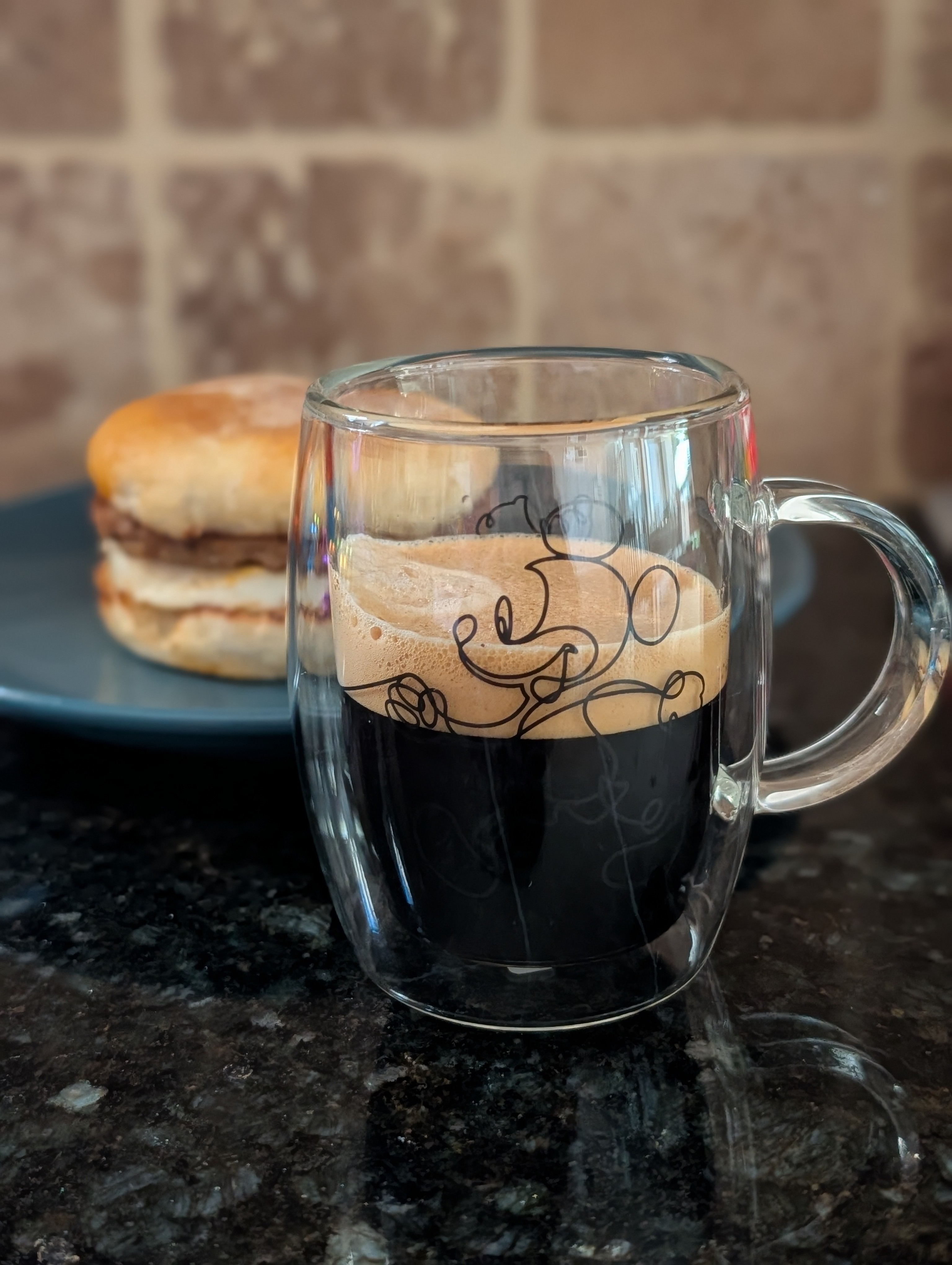 Having a breakfast sandwich with a double on a busy Saturday morning