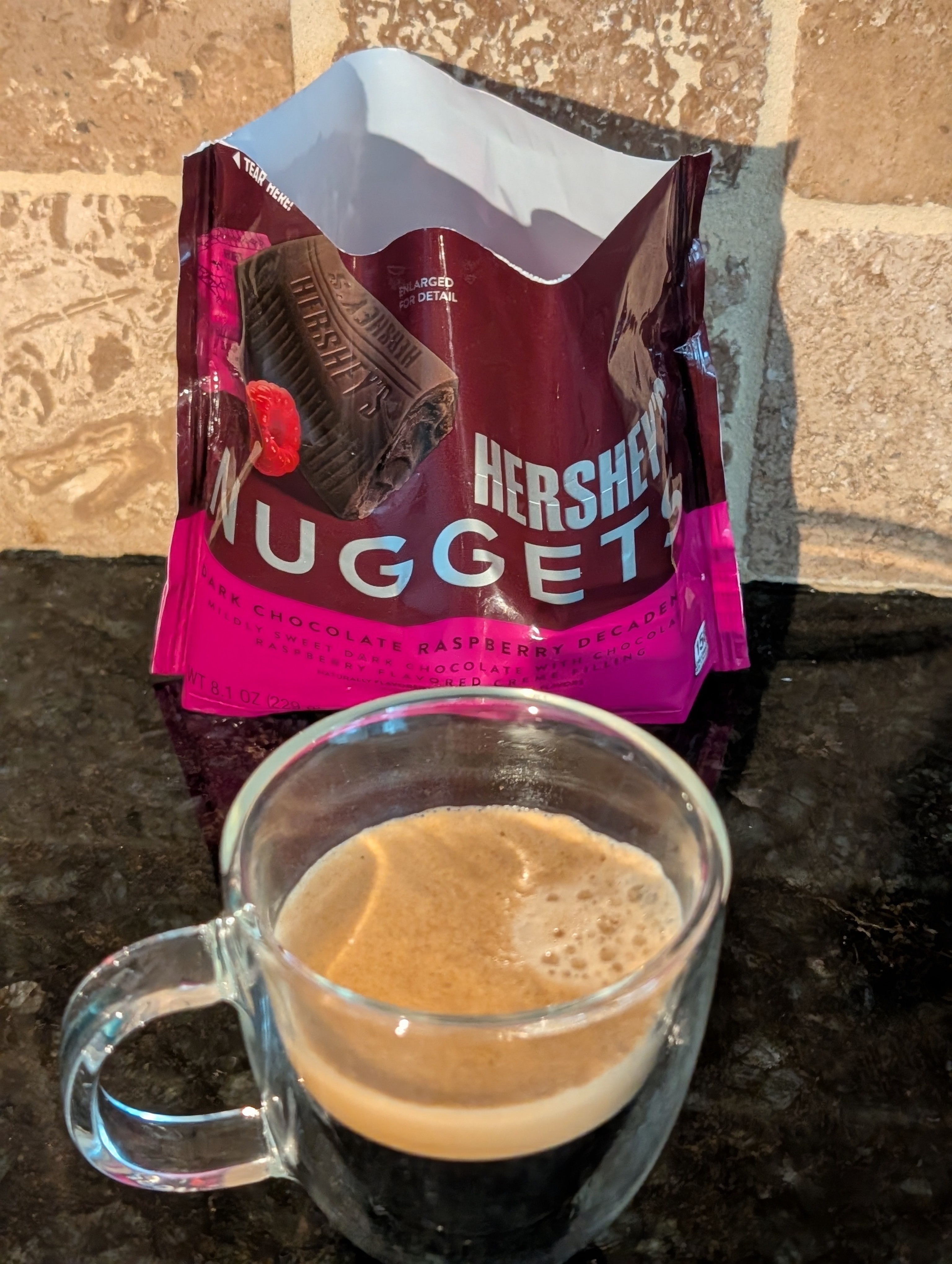 Enjoying some dark chocolate with liquid raspberry center right after a lunch meeting