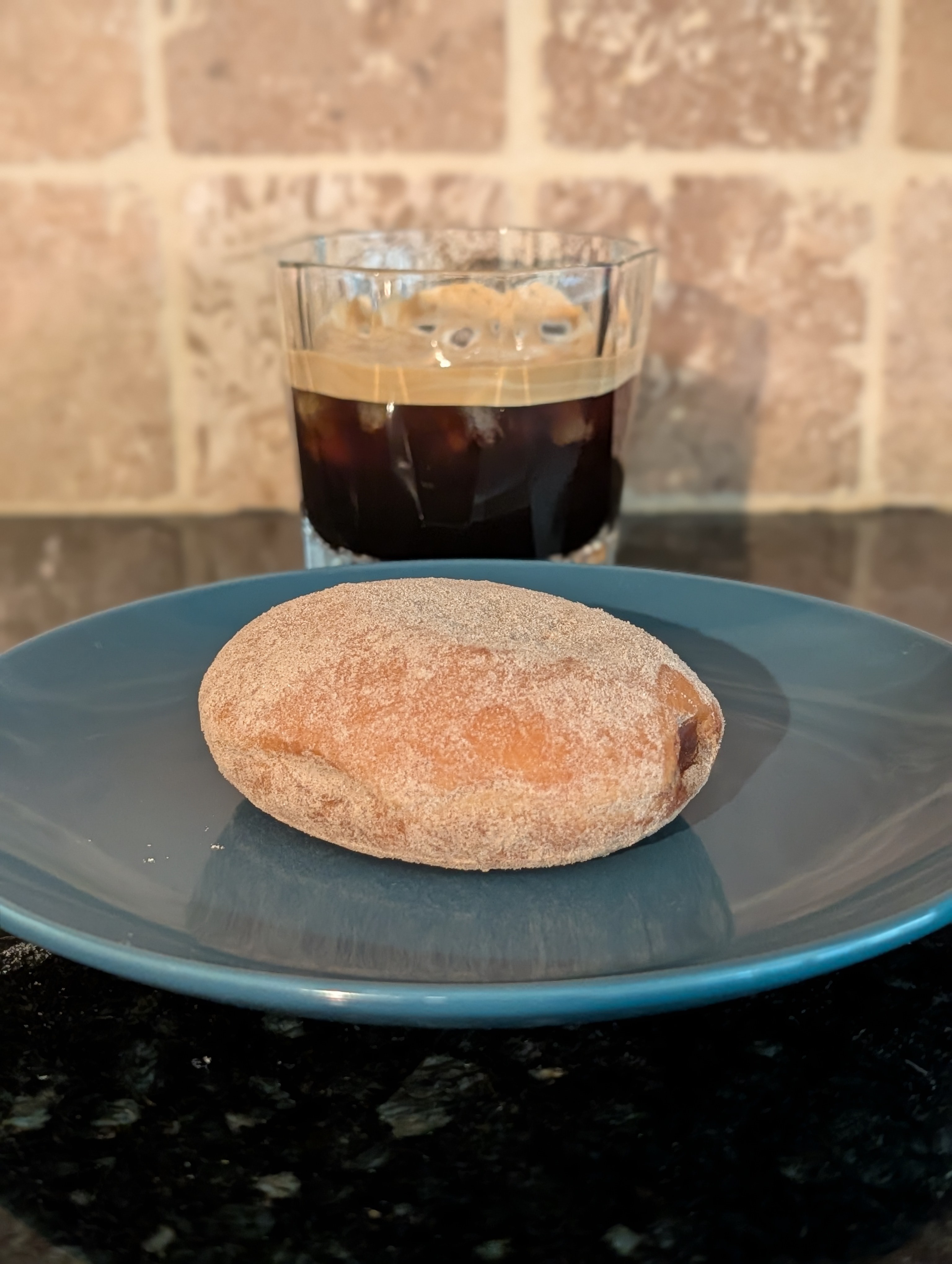 Cooling off with an iced double with a cinnamon Krispy Kreme with apple filling 😋