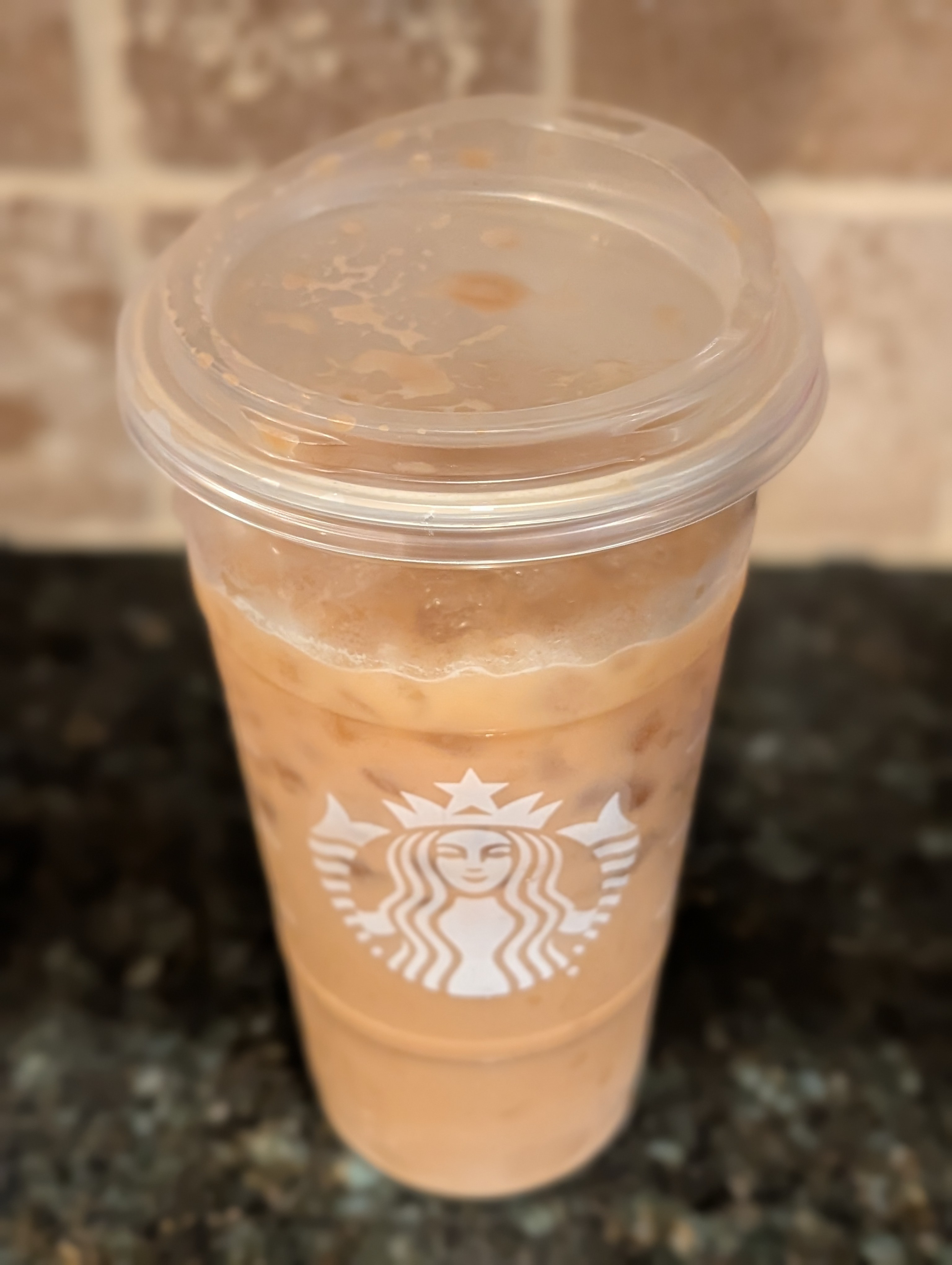 Finishing an unwanted hazelnut oat milk shaken iced espresso