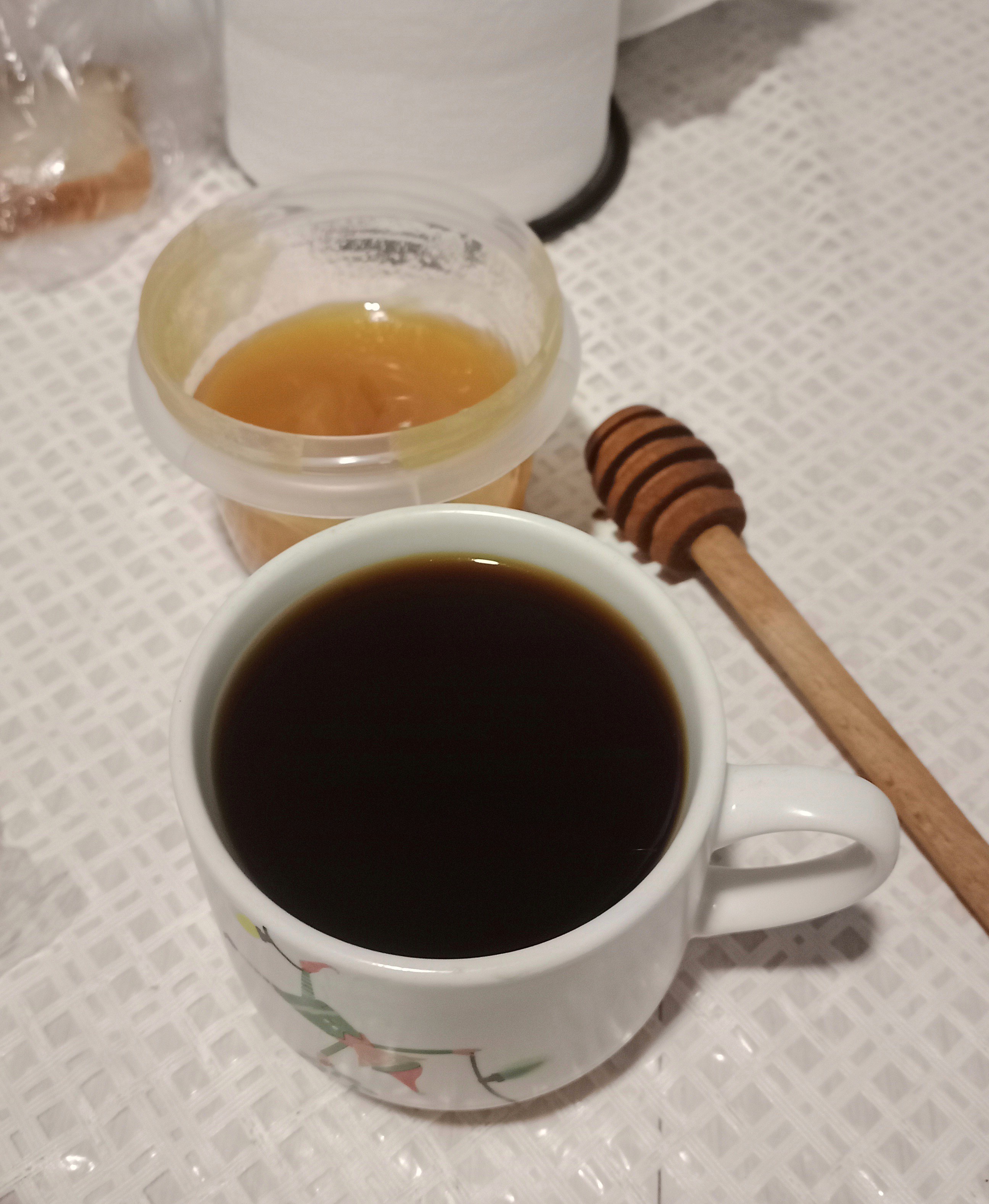 Coffee with a portion of honey