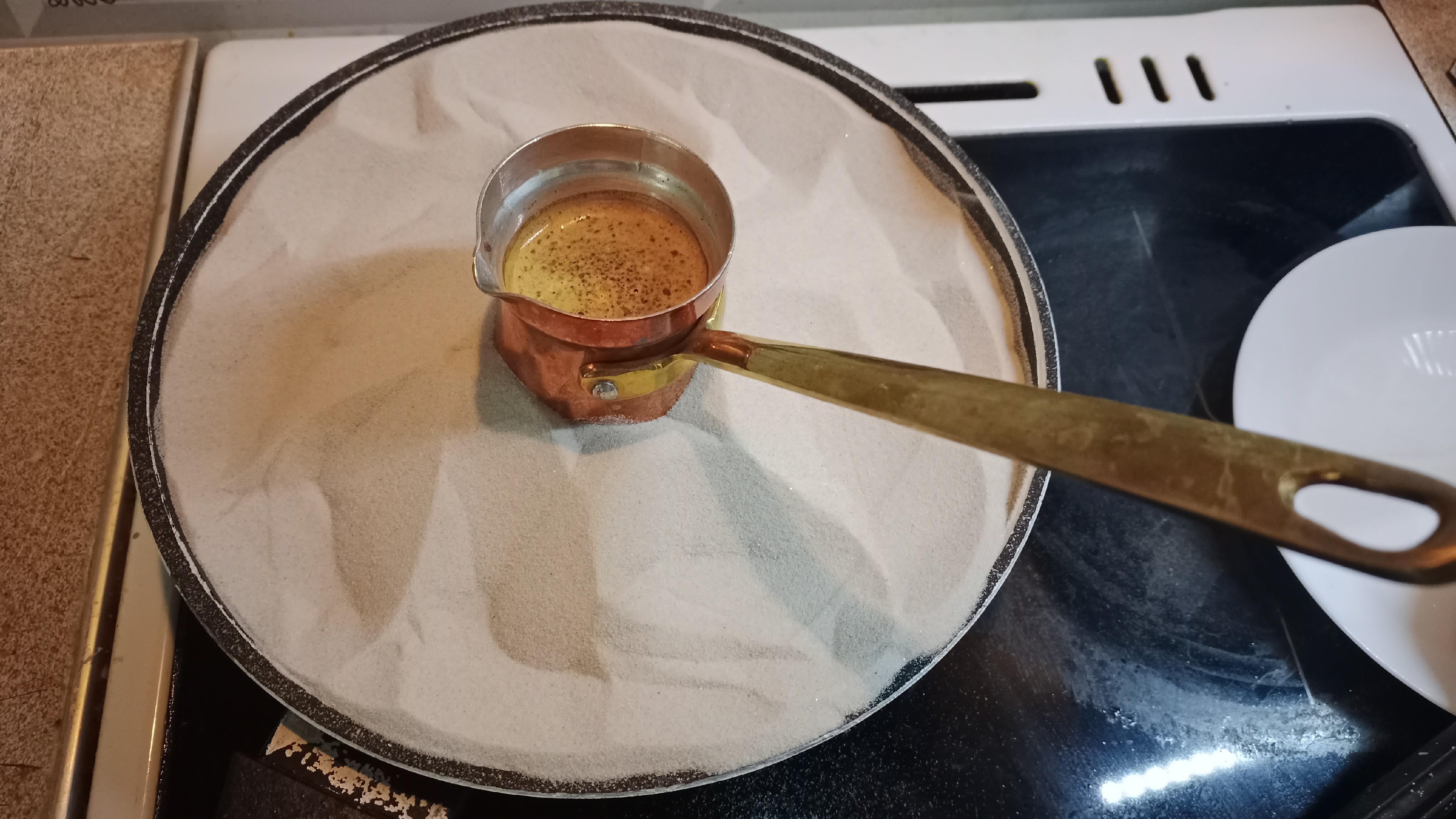 Discovering the Art of Eastern Coffee Brewing 🌍☕️

I recently added a new element to my coffee-making routine—sand for brewing Turkish coffee in a cezve. This method transforms the traditional stovetop experience into an exotic ritual!

🔥 Key Takeaways:
• Properly heating the sand is crucial—it took some time to reach the ideal temperature. My first attempt only got the water up to 75°C, but extended extraction saved the day.  
• The result was rich, flavorful coffee with a deep complexity that’s hard to achieve otherwise.  
• It takes longer than usual methods, making it perfect as a performance piece when entertaining guests.

Embrace this ancient technique and elevate your next coffee gathering!