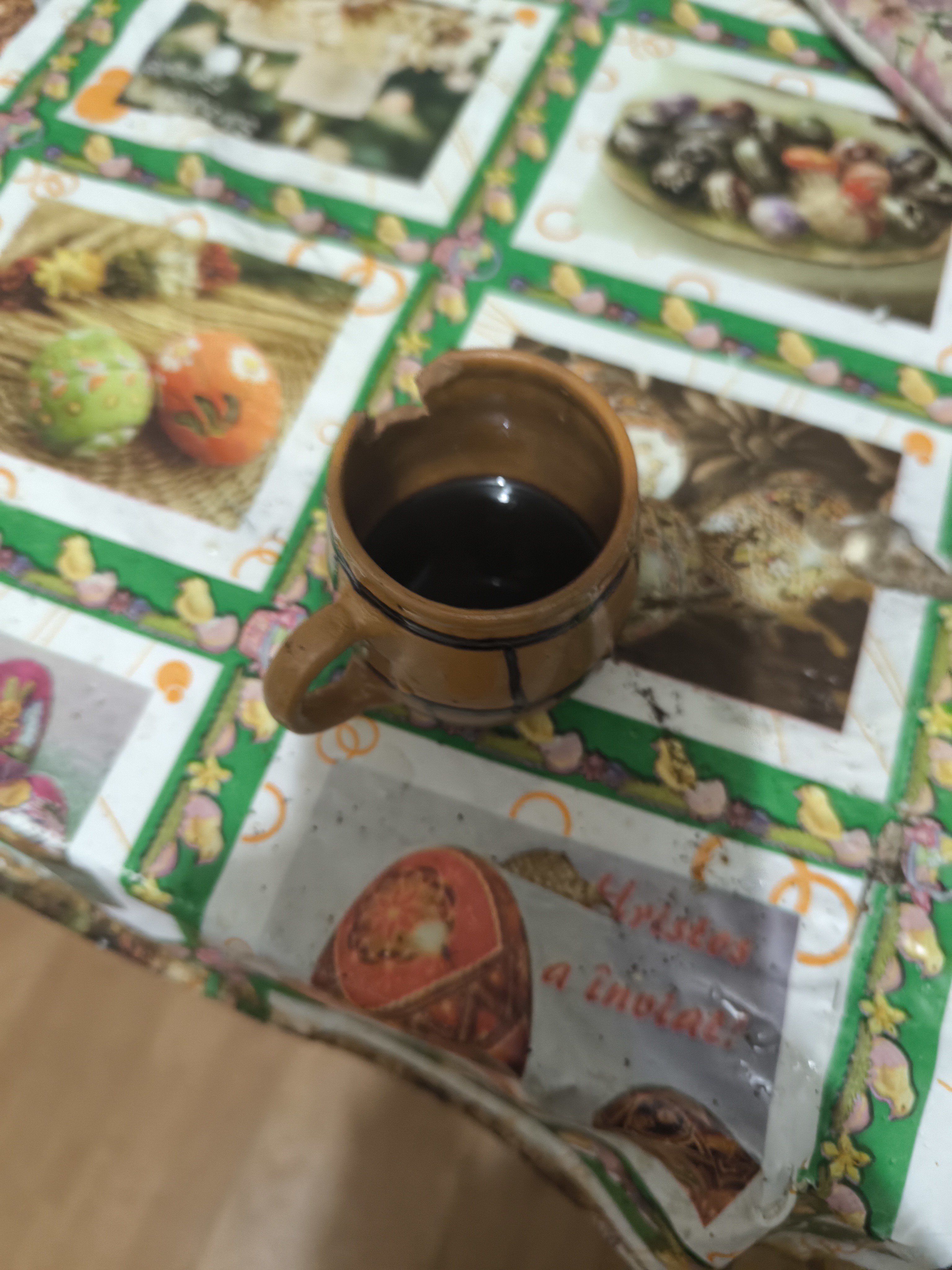 Italian espresso in a cracked cup in the form of a barrel
