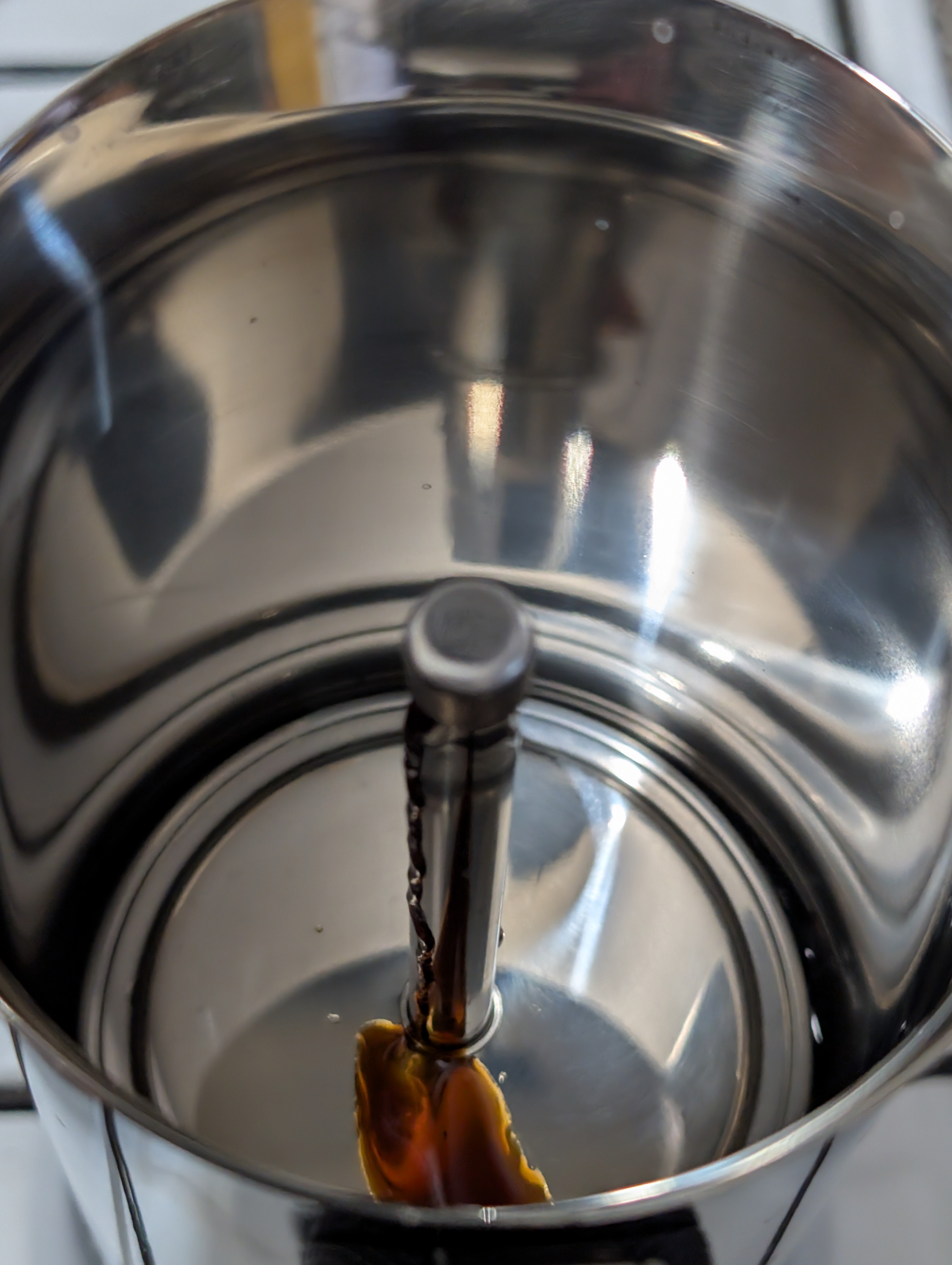 Waiting for the Moka pot to deliver magic.