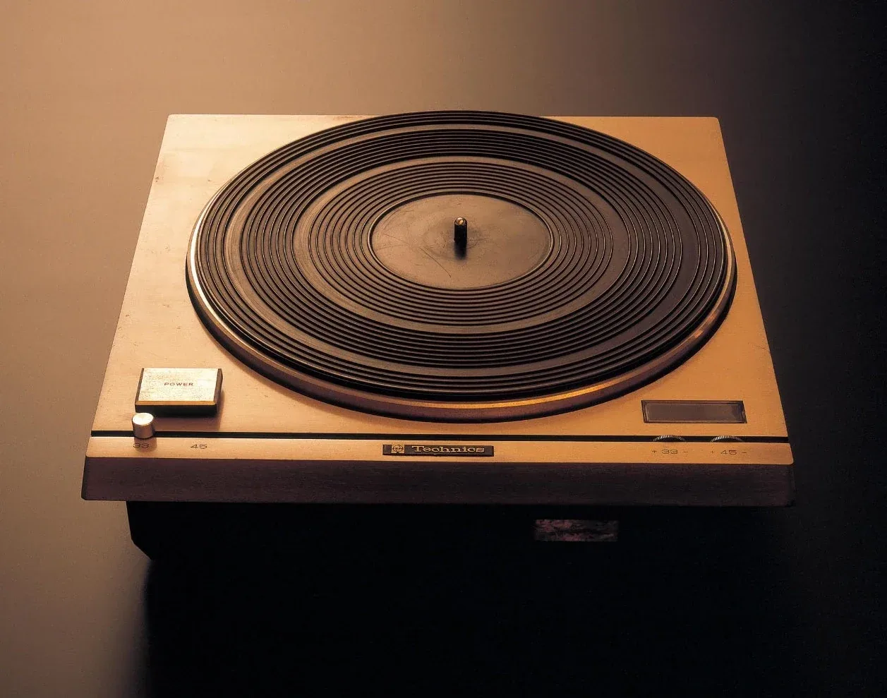 Official historical photograph of the 1970 Technics SP-10, a square motor unit with a large circular platter and no integrated tonearm.
