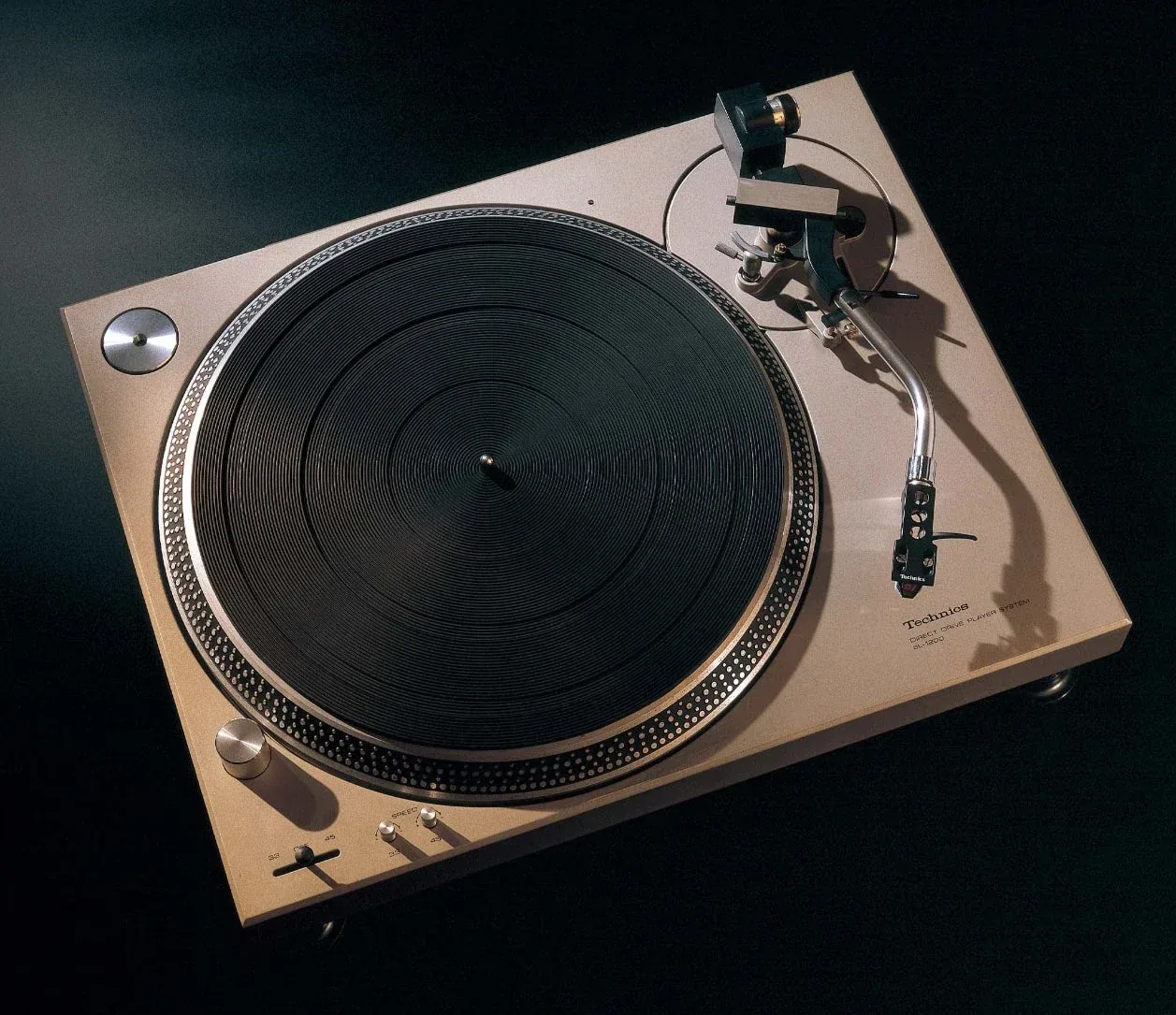 Official historical photograph of the original silver 1972 Technics SL-1200 with its large platter, S-shaped tonearm and rotary speed adjustment.