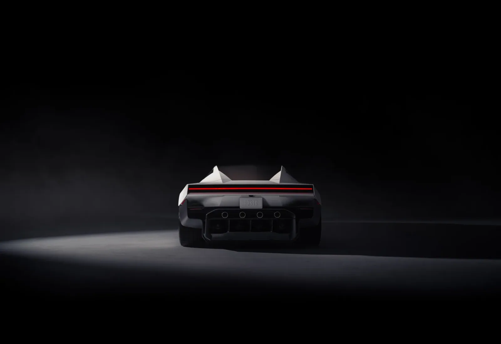 Straight-on rear studio view with the wing lowered.