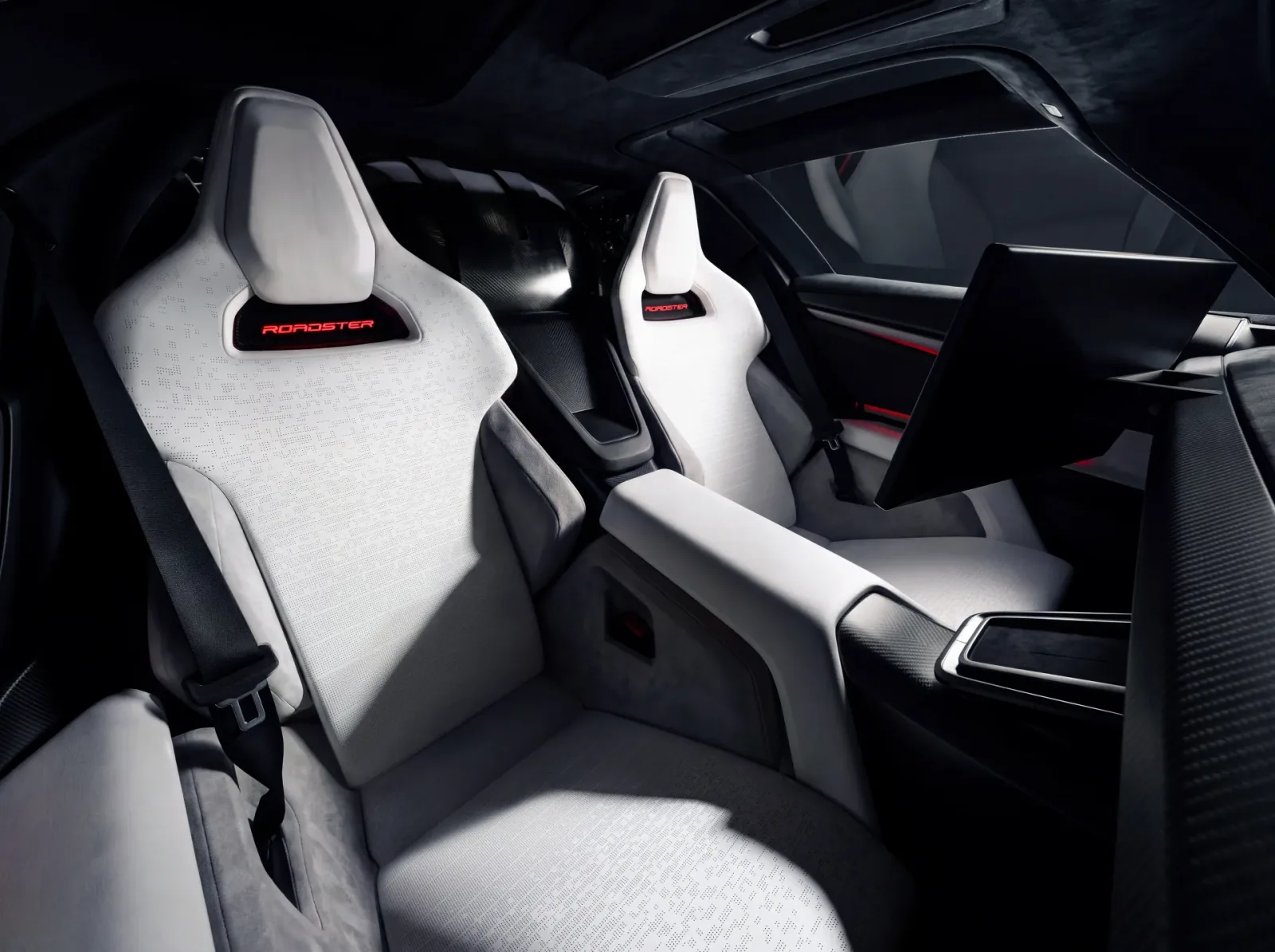 Two seats and the center console viewed from the front of the cabin.