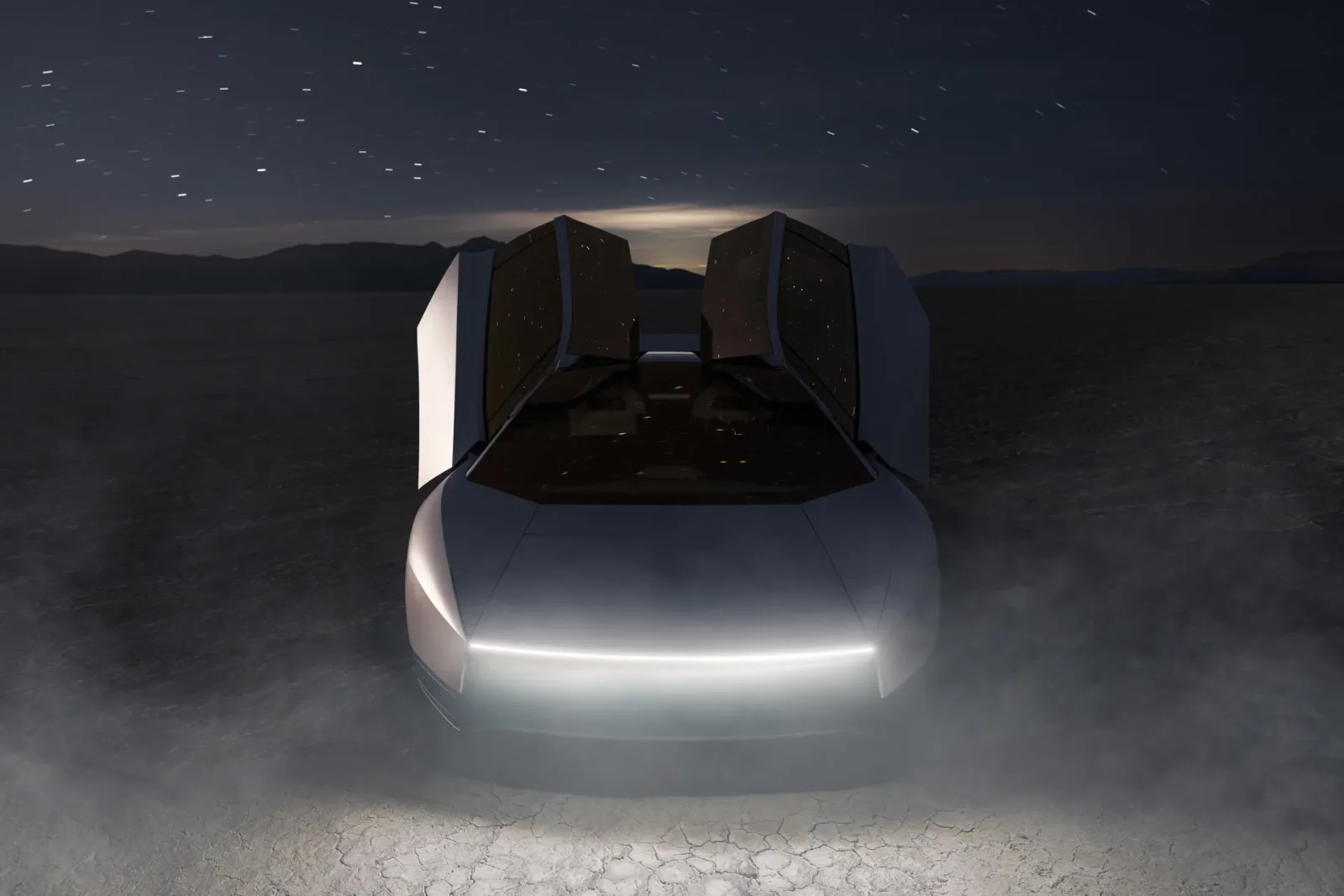Front view with raised doors and the front lighting illuminated.