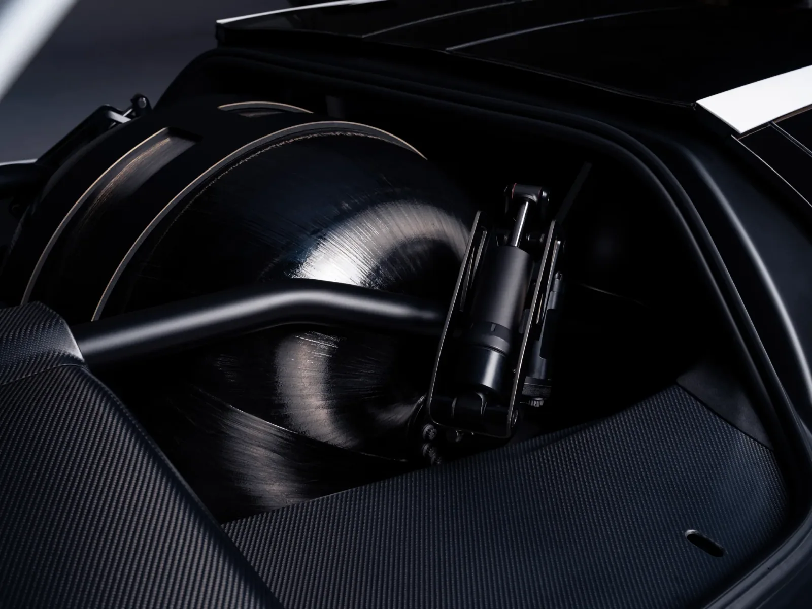 Close-up of a wheel housing and suspension components.