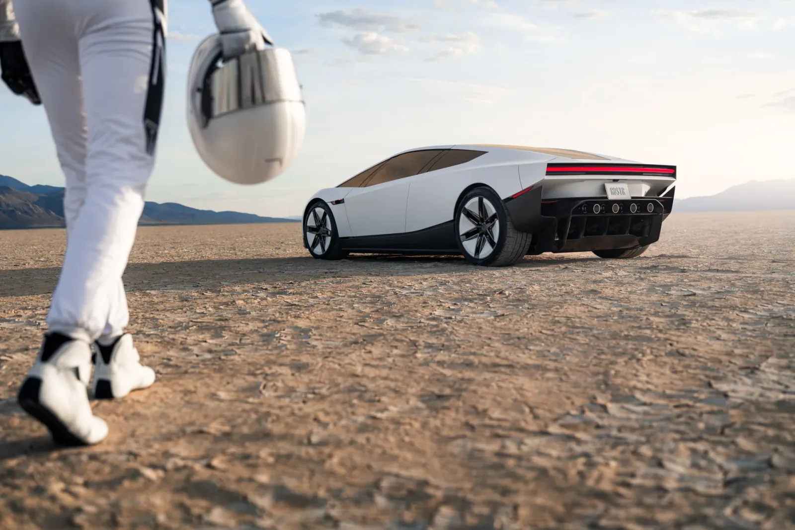 A suited figure carrying a helmet approaches Roadster on open terrain.