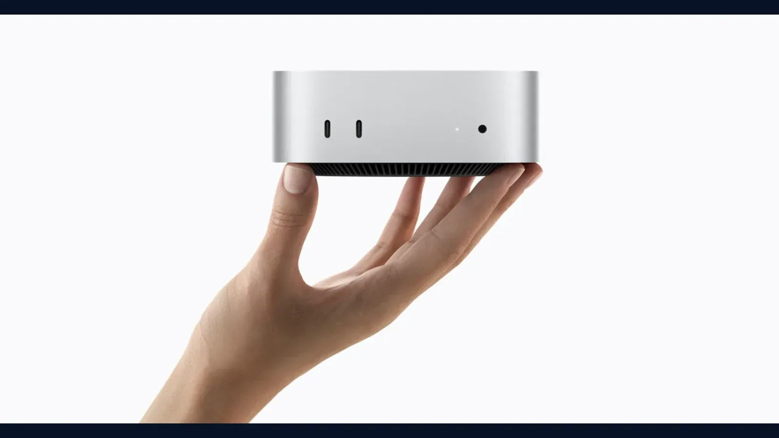 Official Apple press image of the Mac mini with M6, announced for on-device AI and always-on agent work.