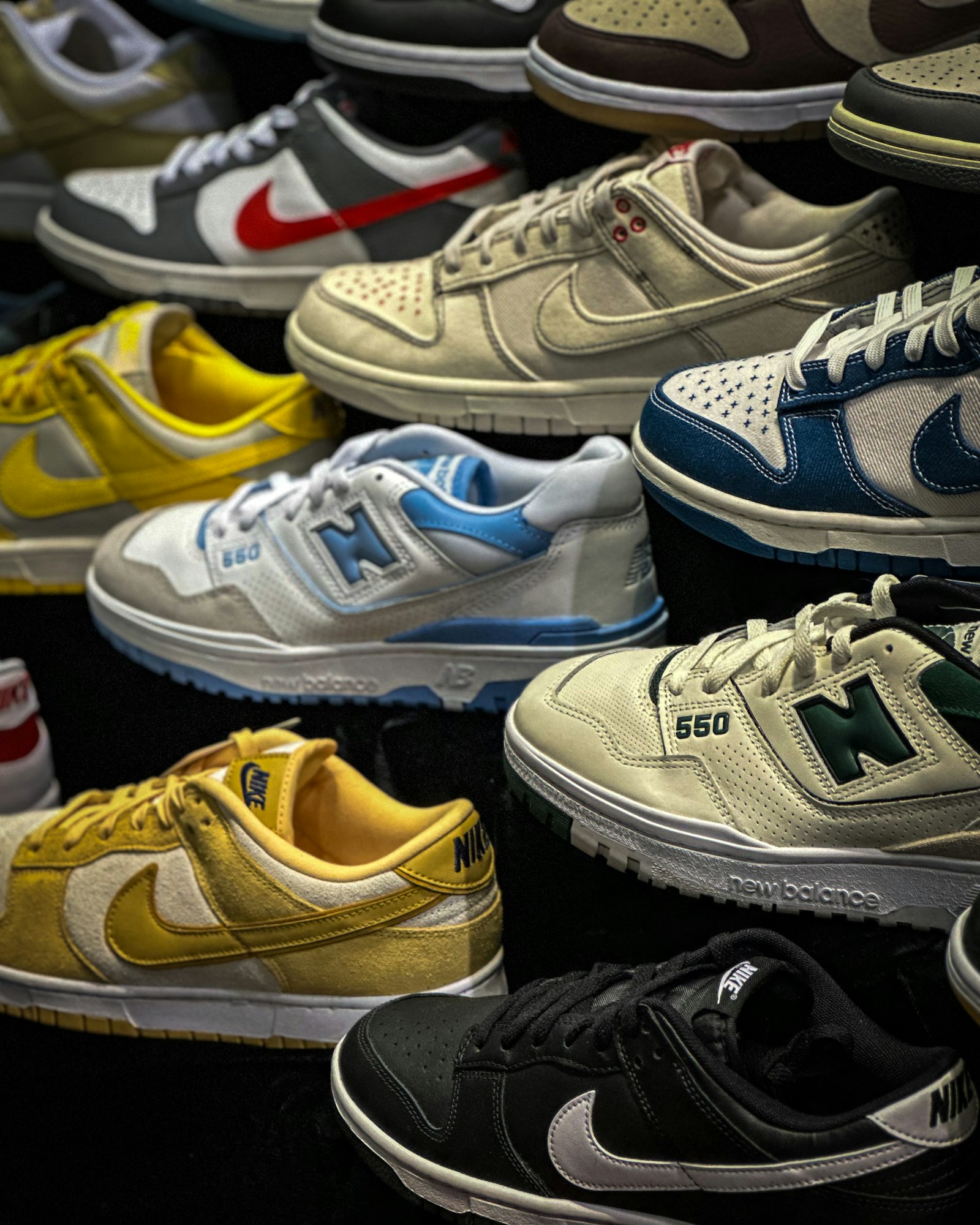 Rows of colorful sneakers stacked pair on pair