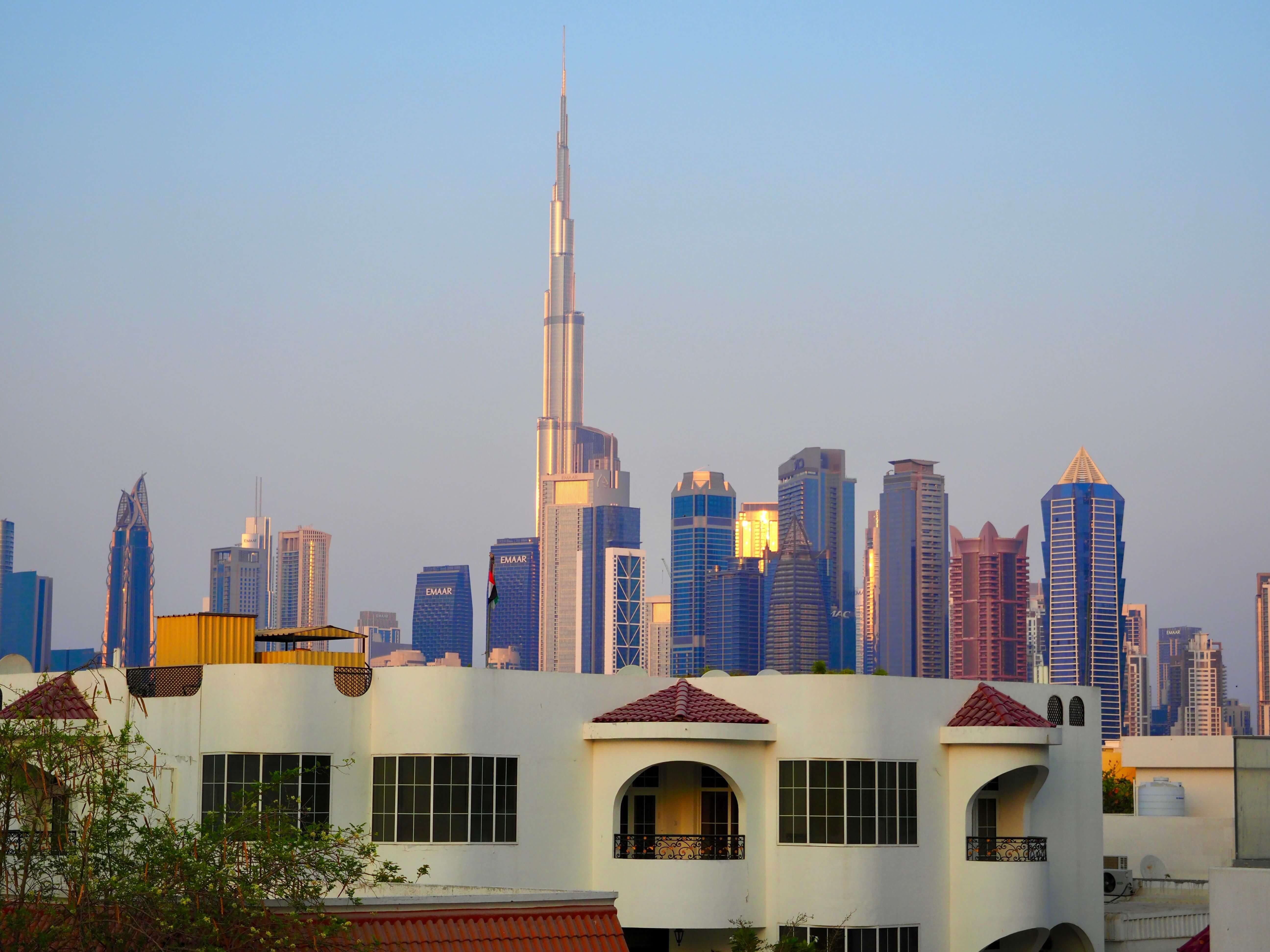 Stunning view of the Dubai skyline with Burj Khalifa during sunset with clear skies