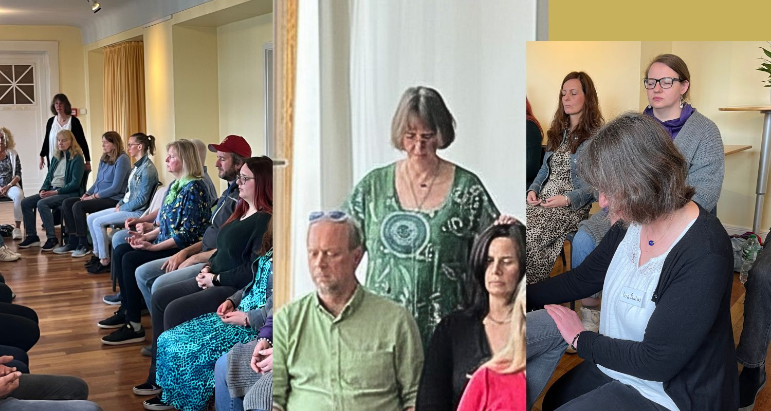 Gruppenheilsession, Ina Paulus gehe zu jedem Teilnehmer und leget die Hände auf.