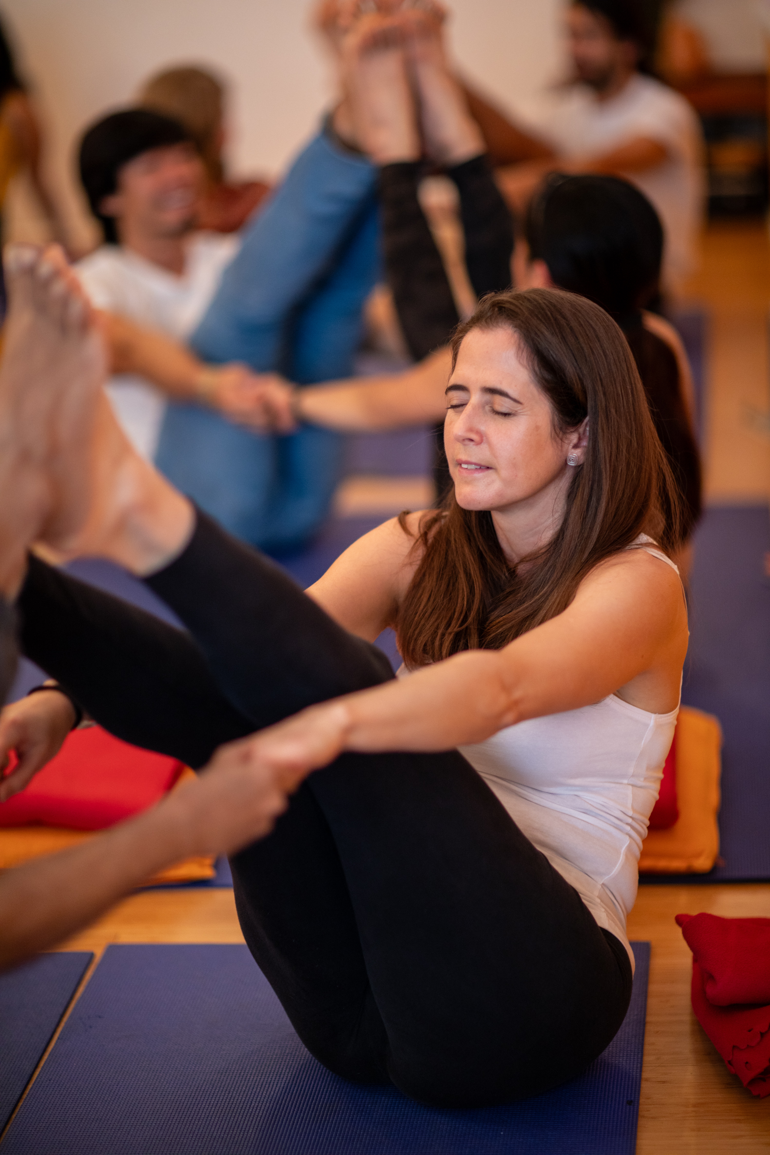 Tuning into the yoga posture together with her partner