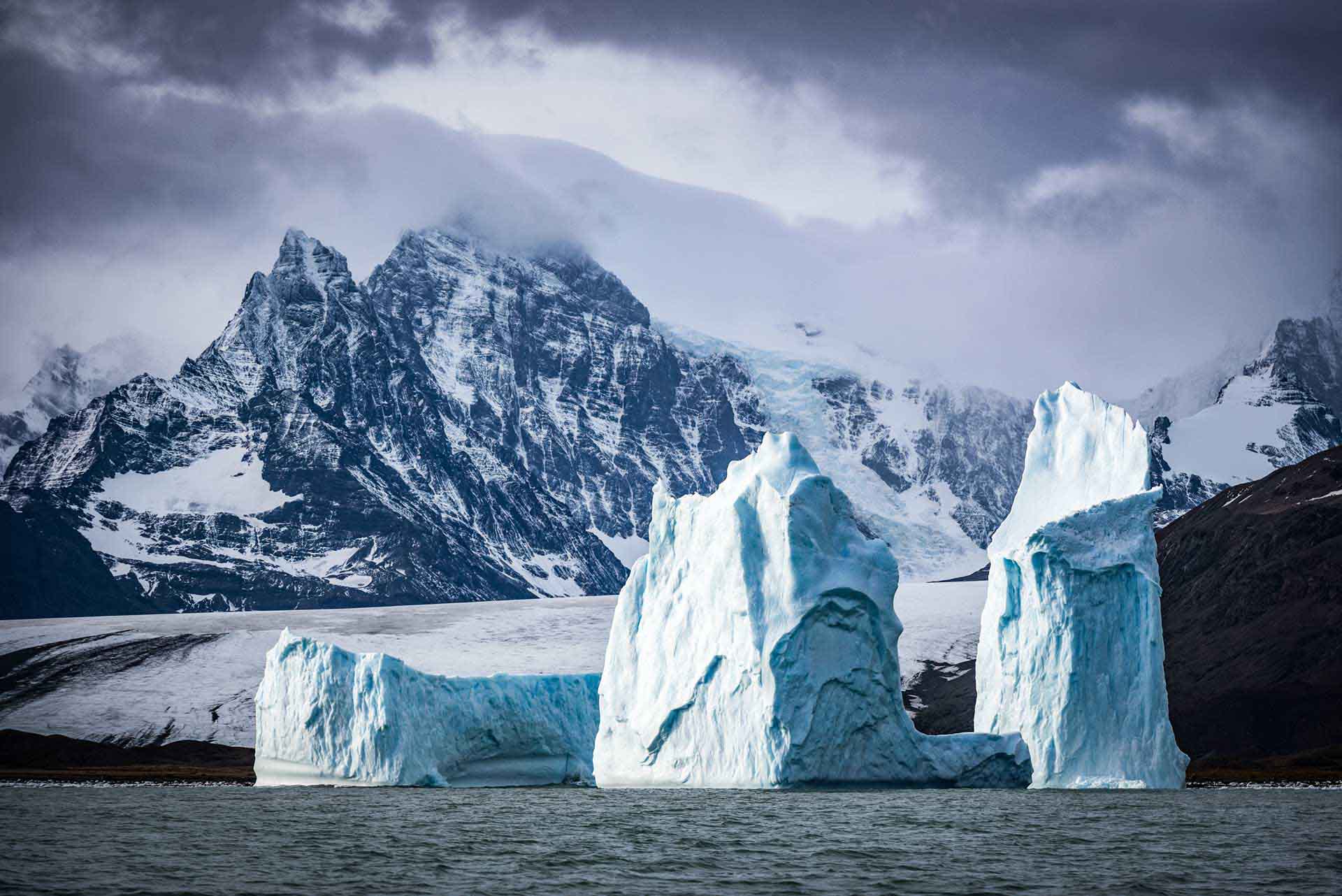 Polar cruise navigating unexplored waters near Glinka Islands in Antarctica