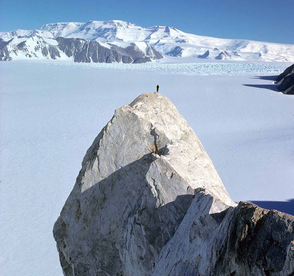 A person stands atop the Tusk | Antarctica