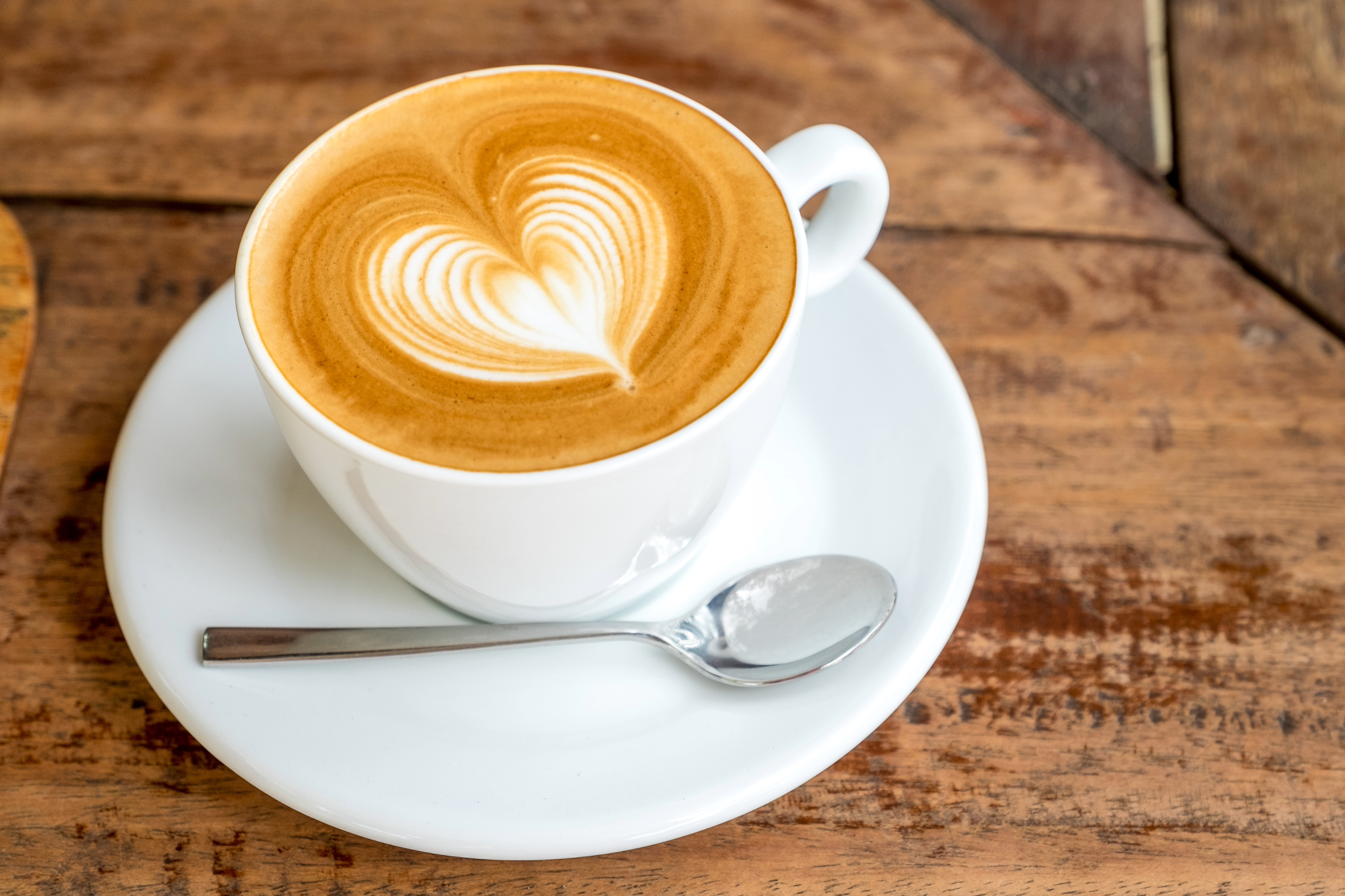Cup of coffee on a saucer at Crepe Time Café