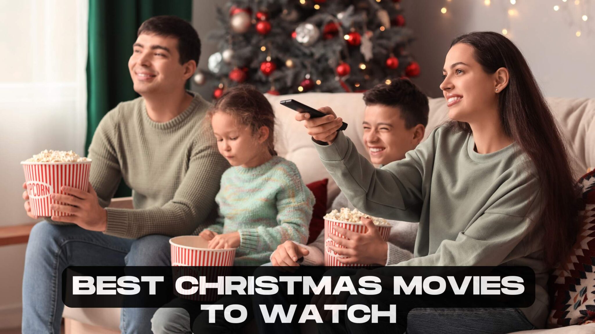 Family watching a Christmas movie together on a cosy sofa in December