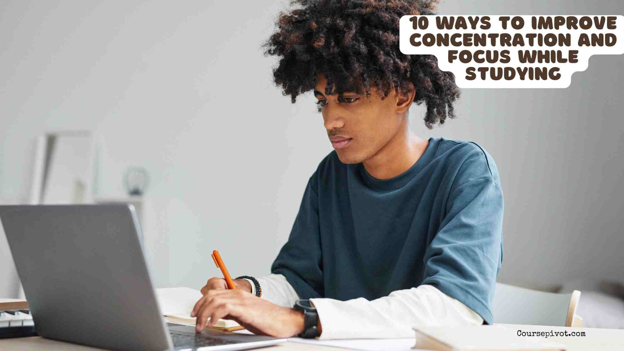Student concentrating while studying at a clean desk