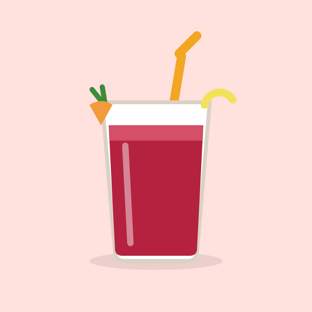 Deep red beet and carrot juice in a glass with a lemon twist