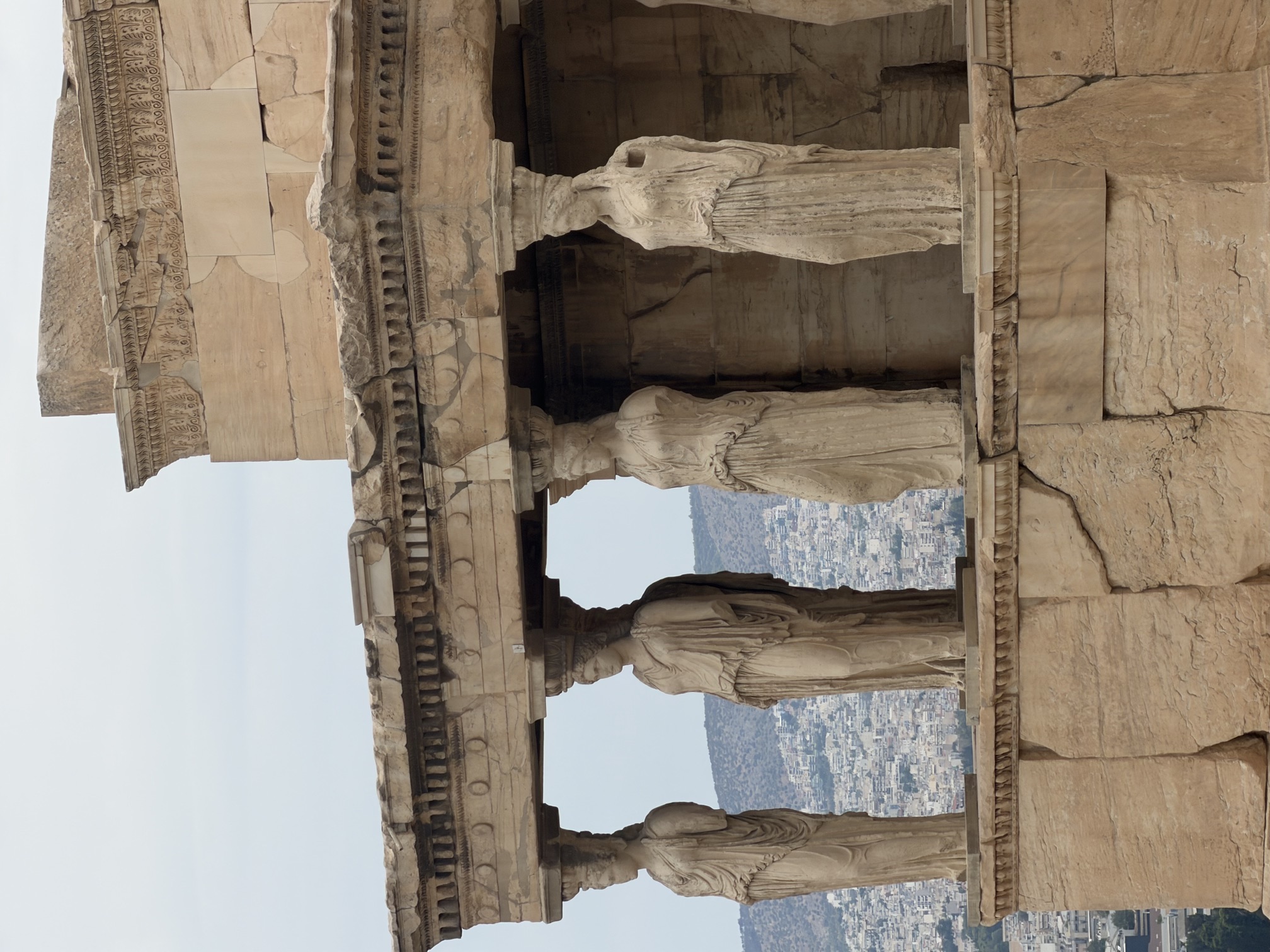 The Caryatids of the Erechtheion above modern Athens
