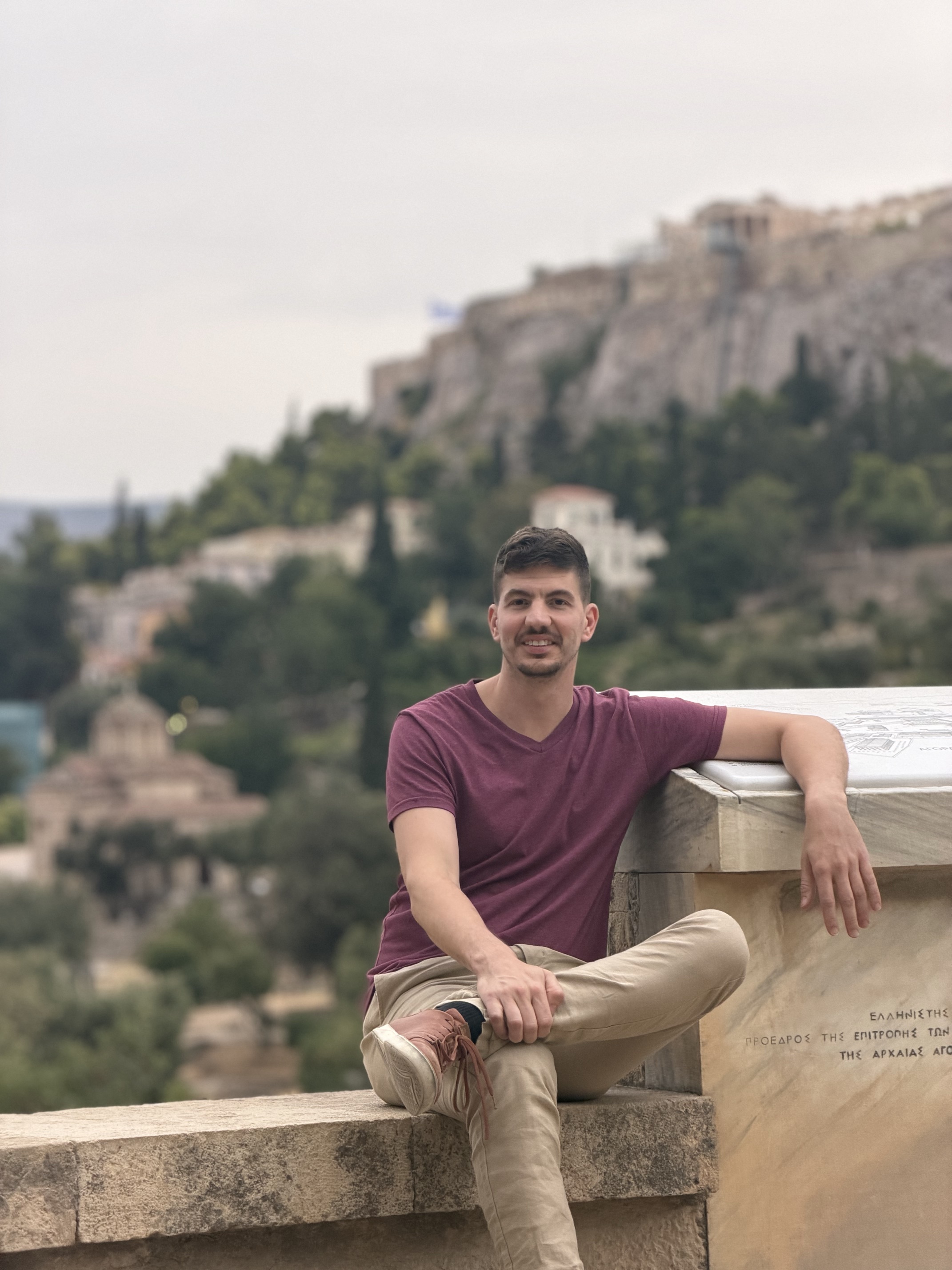 Christopher Heinrich overlooking the Ancient Agora with the Acropolis behind him