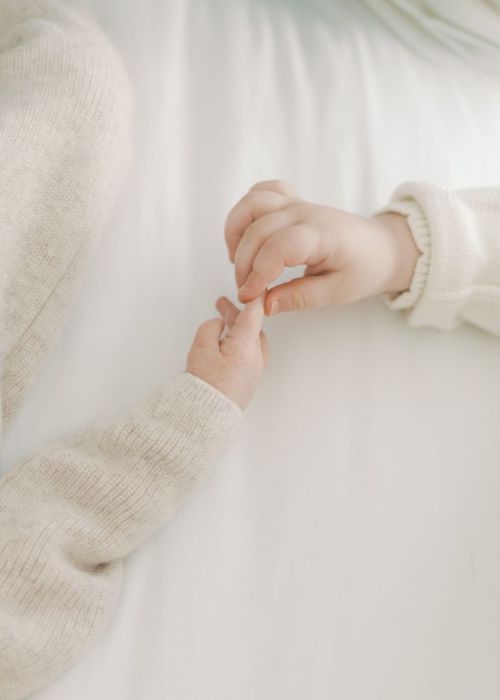Tiny Hands Holding Each Other