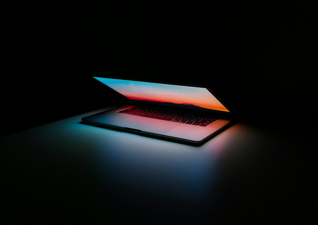 Laptop and notebook used for business insights and planning