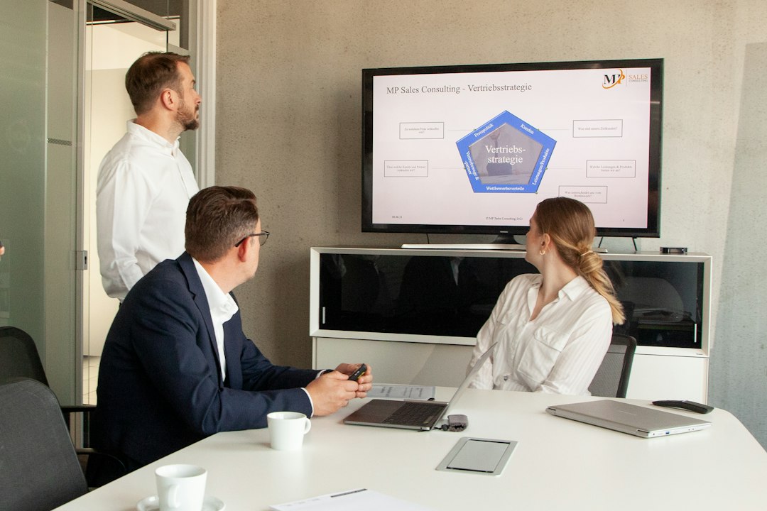 Business team reviewing CRM performance dashboards together