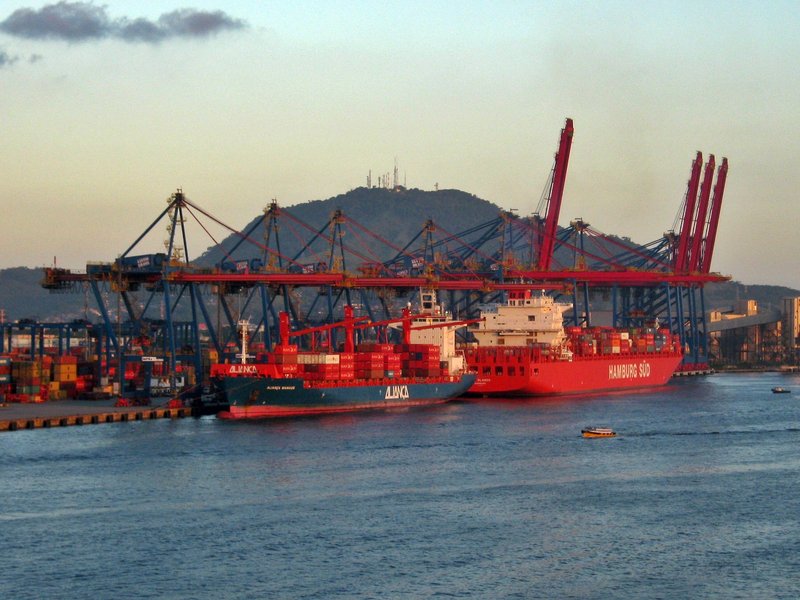 Container ships being worked by gantry cranes at the container terminal in the Port of Santos, Sao Paulo state, Brazil