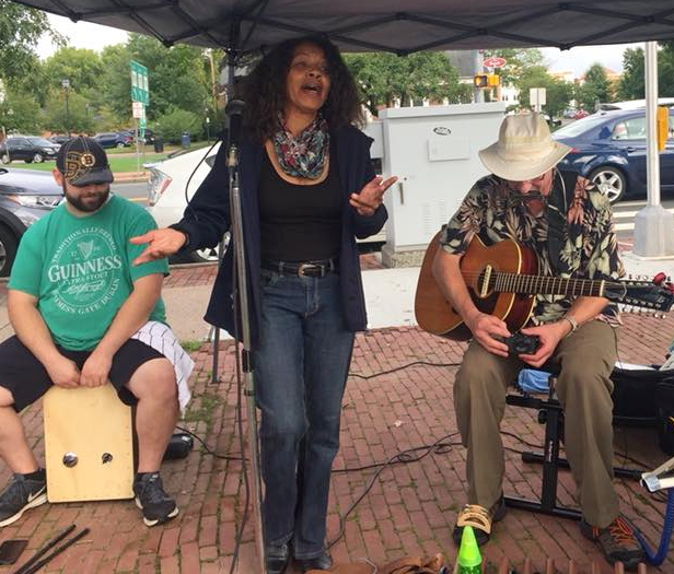 Tomaca Singing At Market