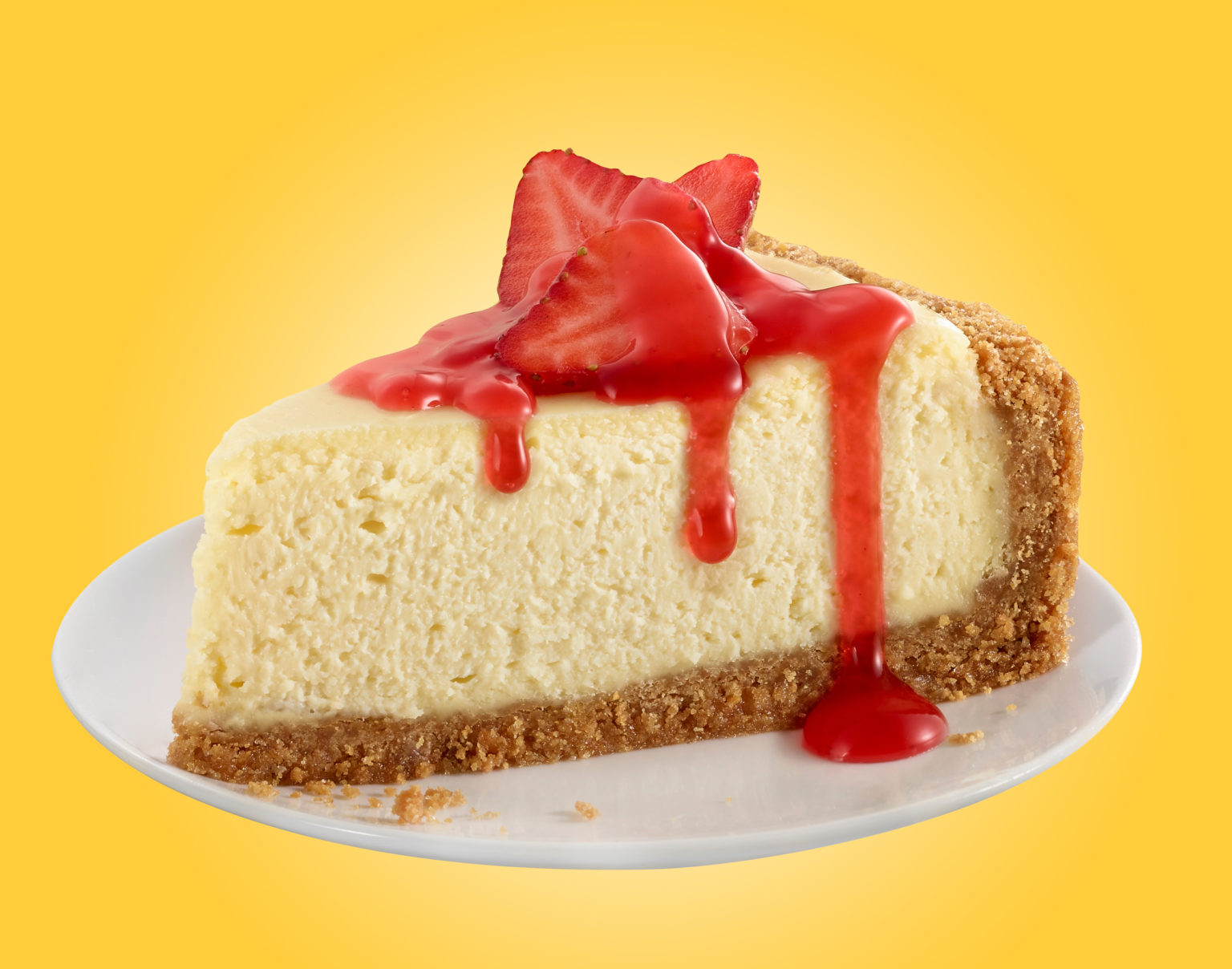 plate of cheesecake, gram cracker crust and strawberry topping.  Yellow background