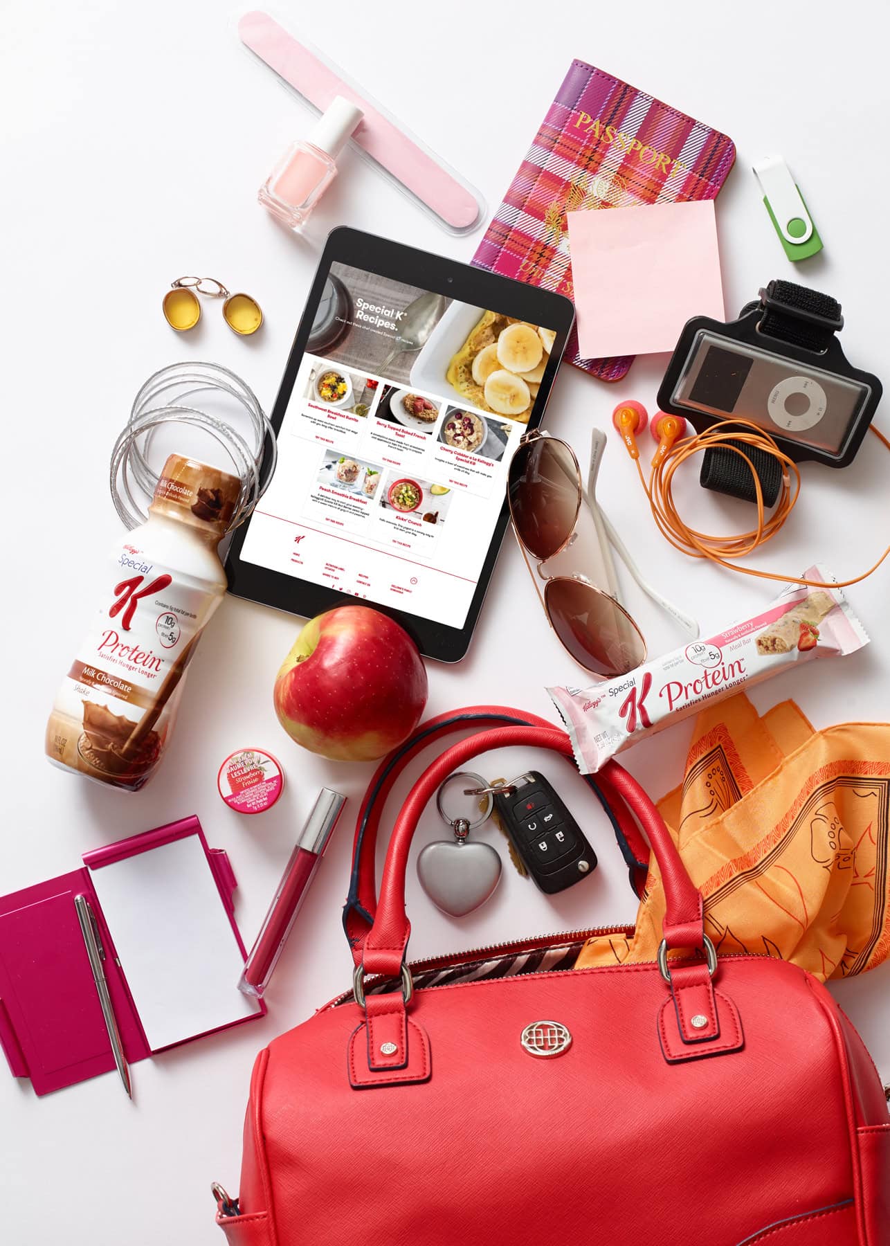 photo of red purse on table with contents spilled onto table and special k bars