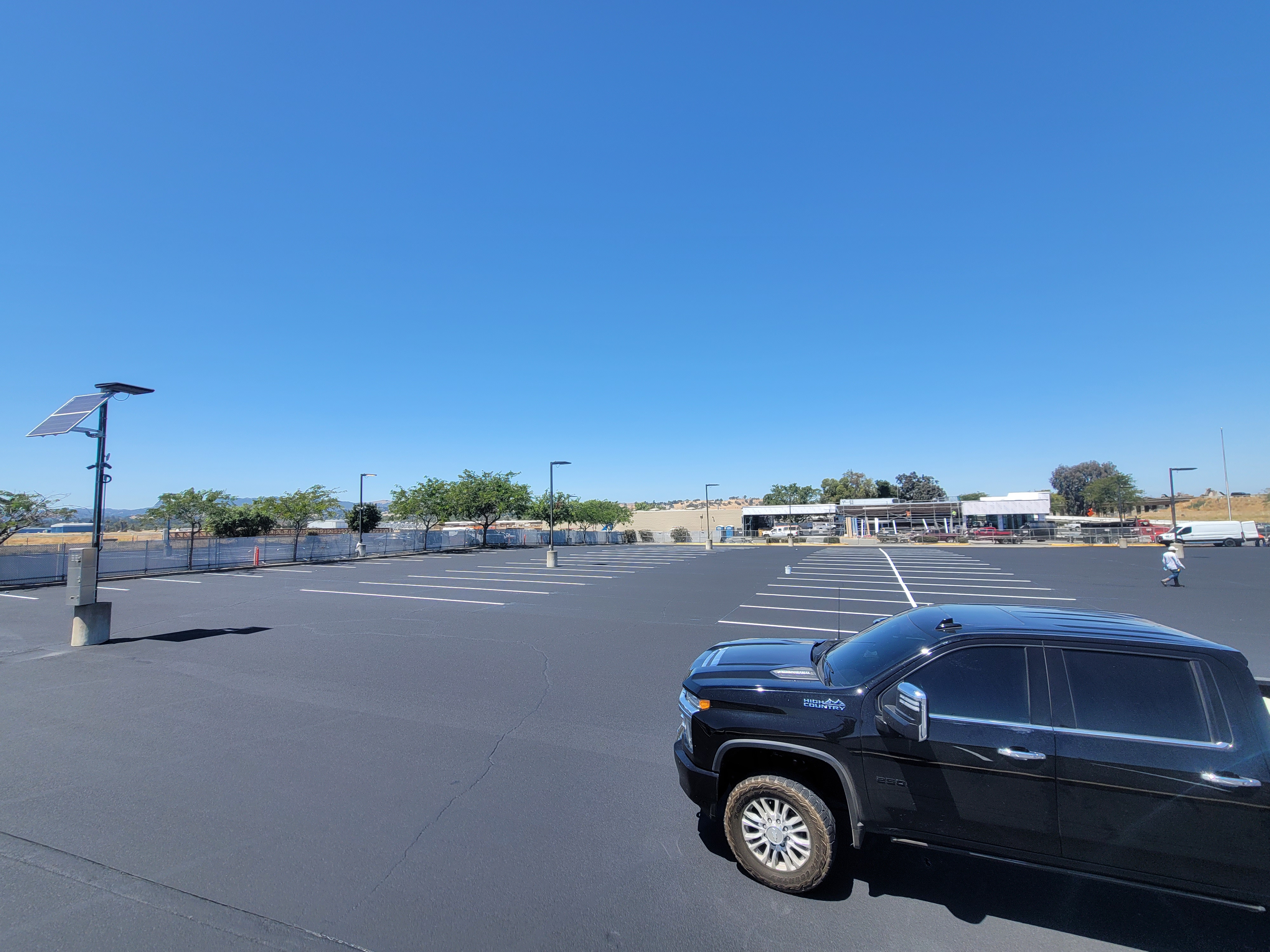 Asphalt parking lot with car