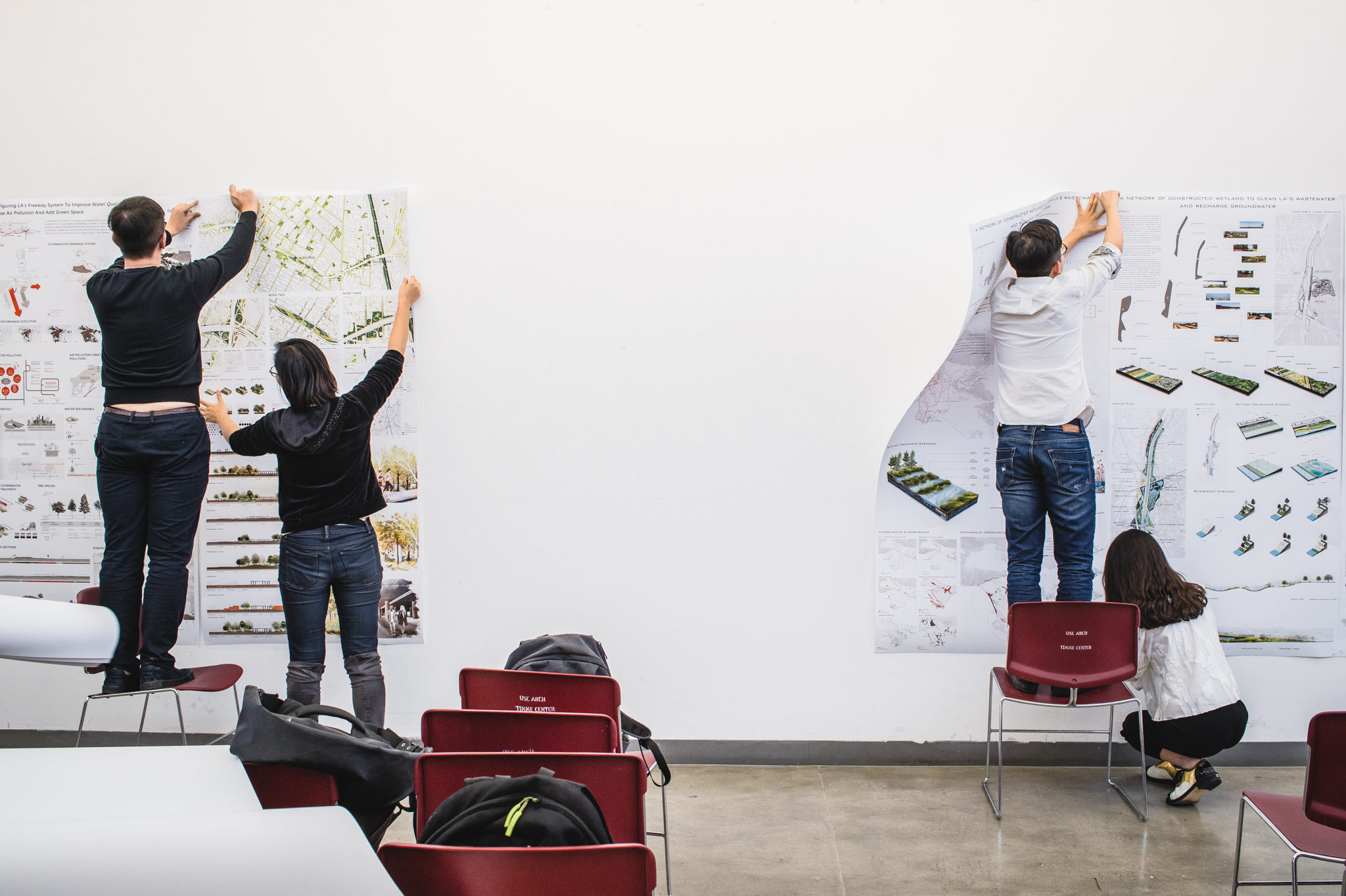 Students pin work for final reviews at the USC School of Architecture