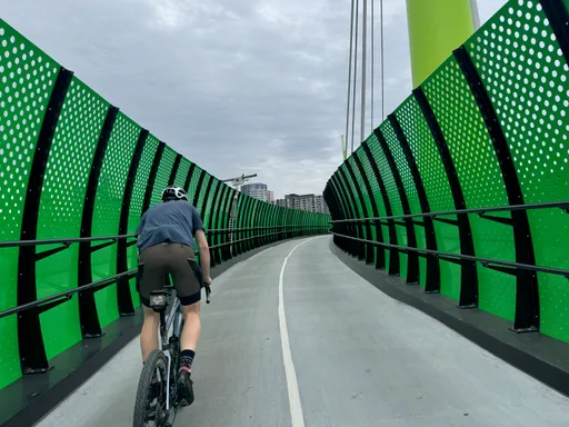 Riding across the green Footscray Road cycling bridge
