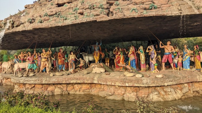 Krishna lifting govardhan hill on his little finger