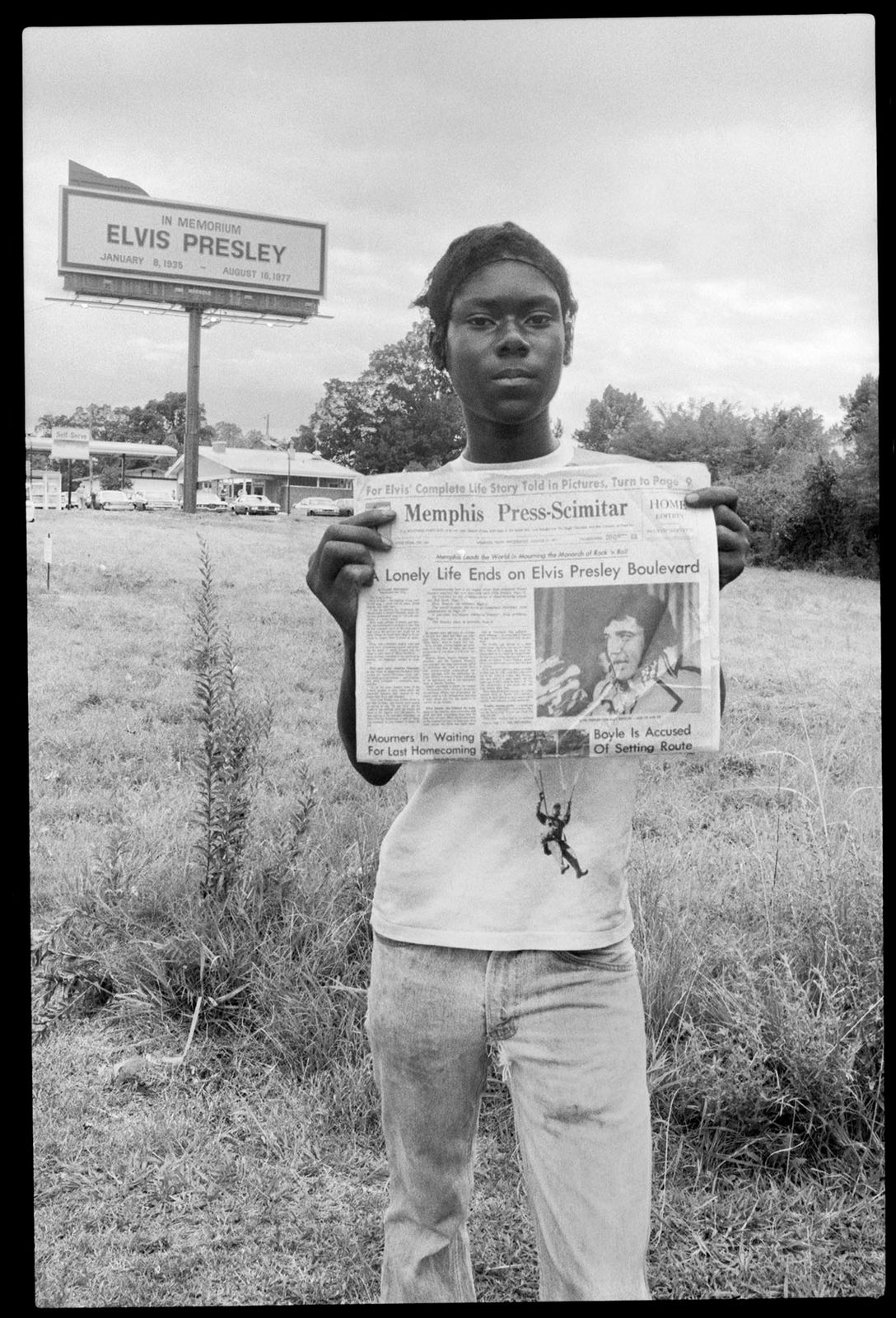 Kid Selling Newspapers at Elvis Funeral 1977