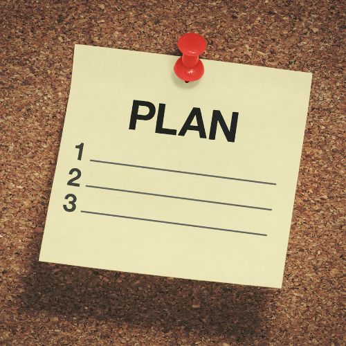 a post-it note with 'plan' written on it