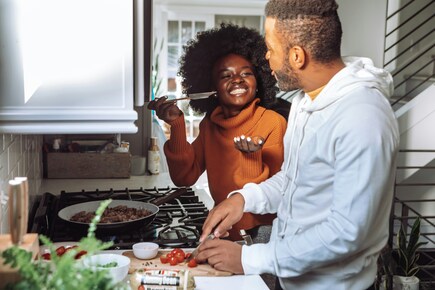 Two people cooking