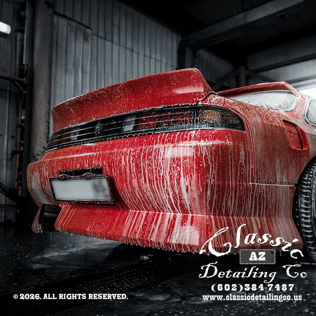 A person detailing a car's interior