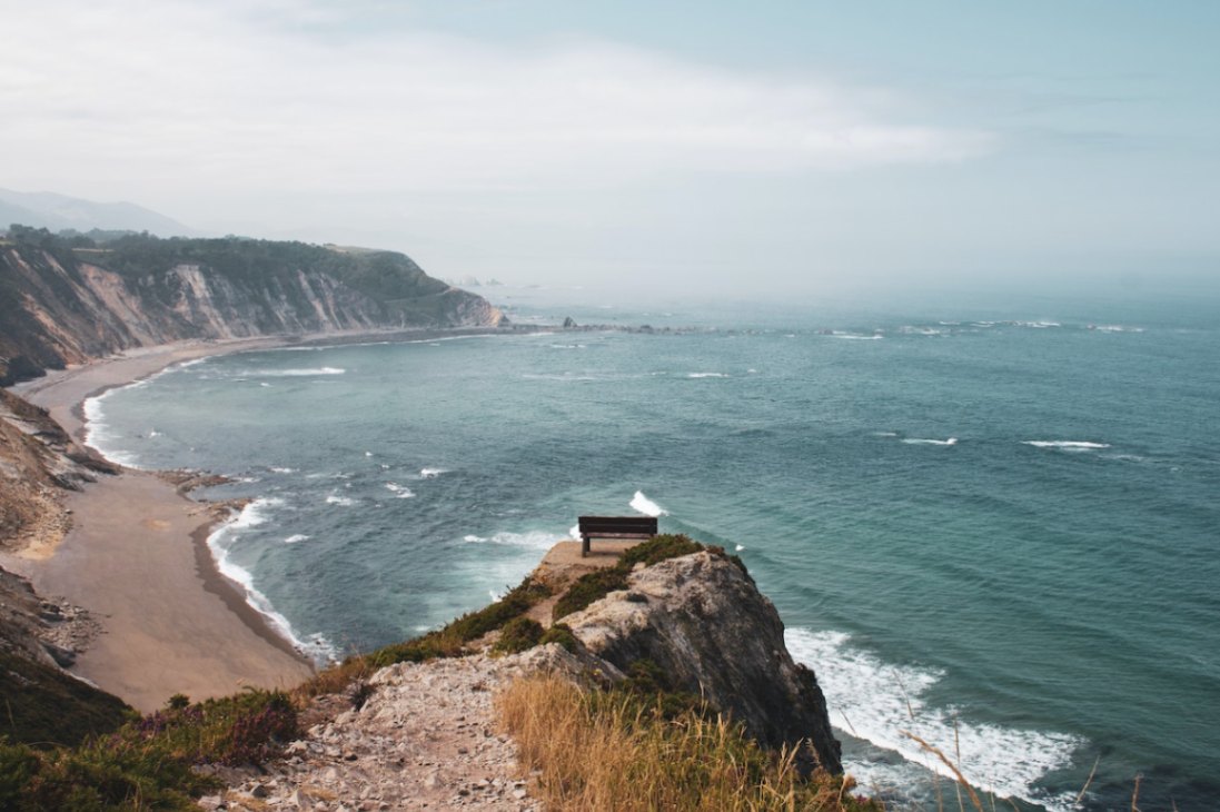 Photo by Mark Neal: https://www.pexels.com/photo/drone-shot-of-a-bench-on-a-cliff-5014373/