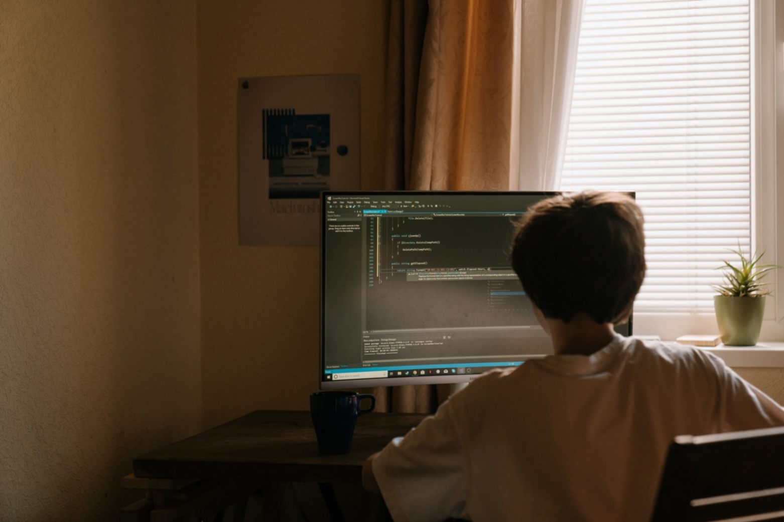 Photo by cottonbro from Pexels: https://www.pexels.com/photo/boy-in-white-shirt-sitting-in-front-of-computer-4709286