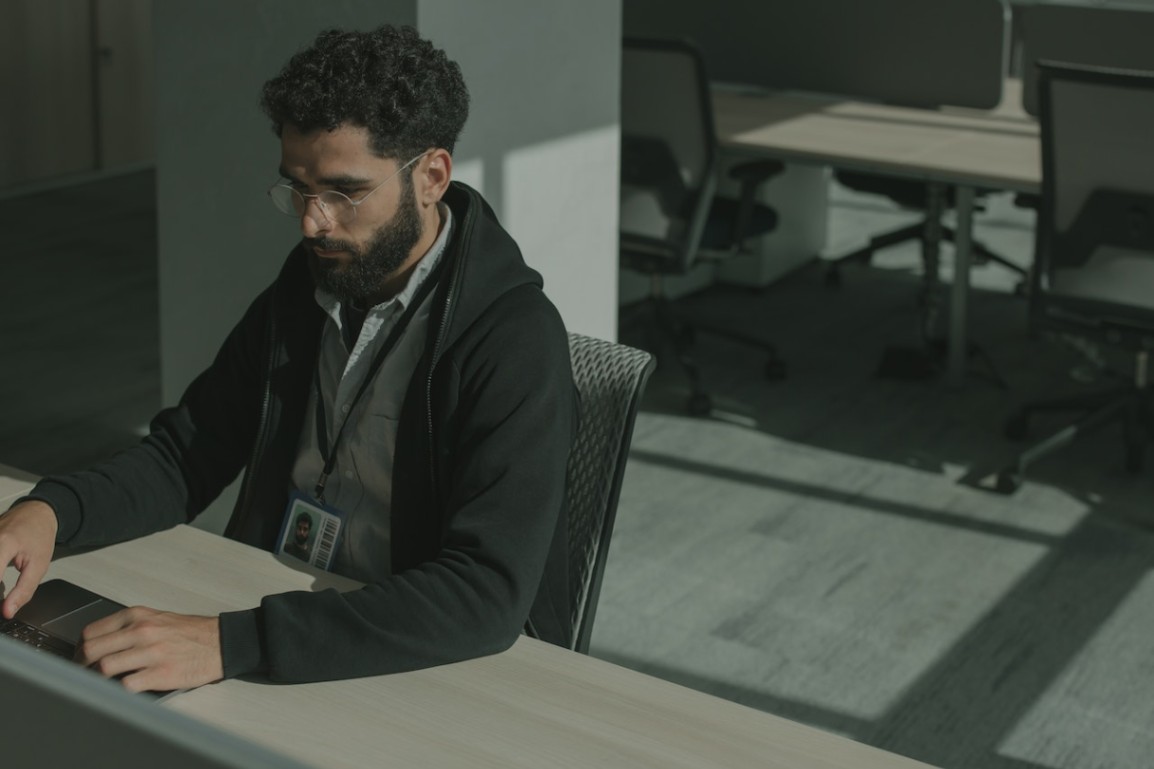 Photo by cottonbro studio: https://www.pexels.com/photo/a-man-in-black-suit-jacket-sitting-on-a-gray-chair-5483148/