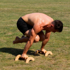 Tuck Planche on parallettes