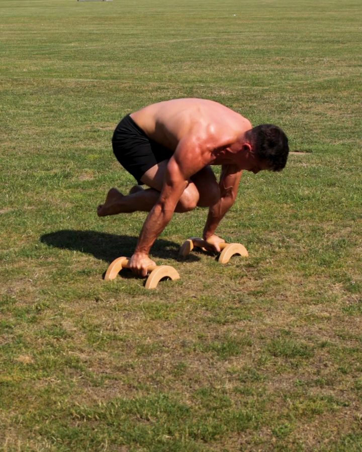 Tuck Planche on parallettes