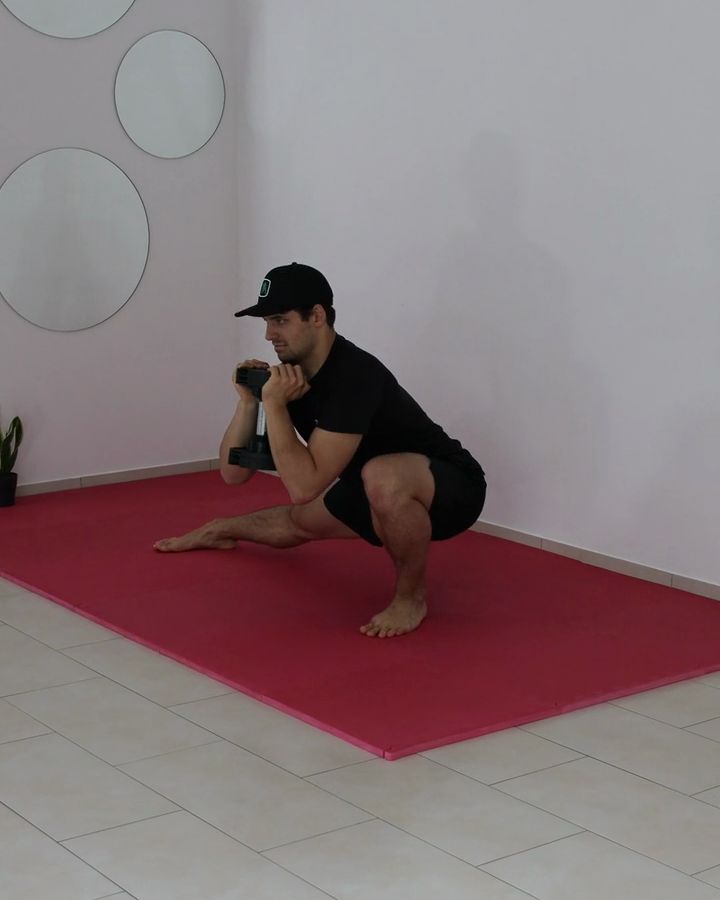 Weighted Cossack Squats with a dumbbell